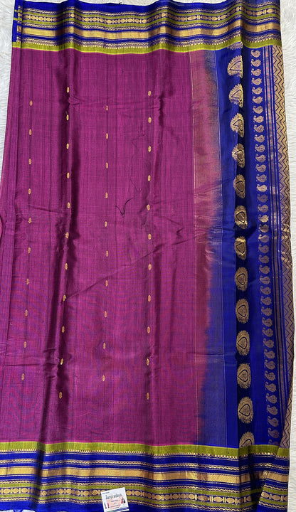 Gadwal Sico Saree Magenta colored complemented with a Ink Blue Kanchi Gap Border. - Sampradaya Designer Studio