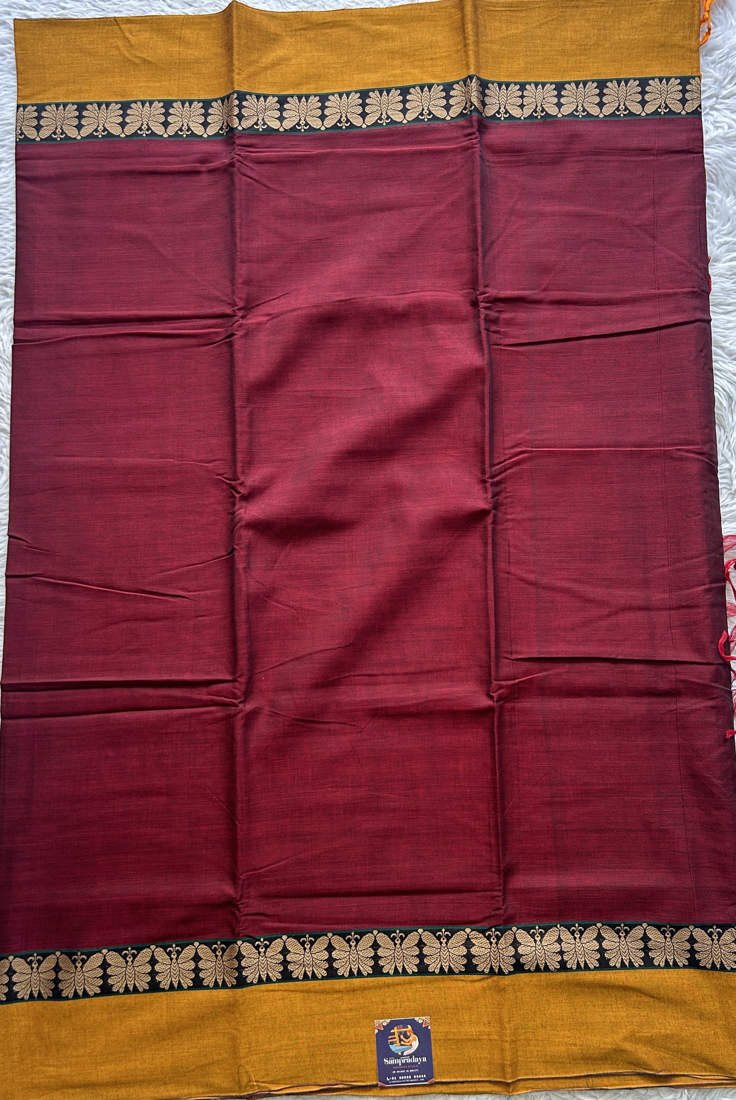 Narayanpet Cotton Saree Maroon Colored Complemented with a Thread Border.