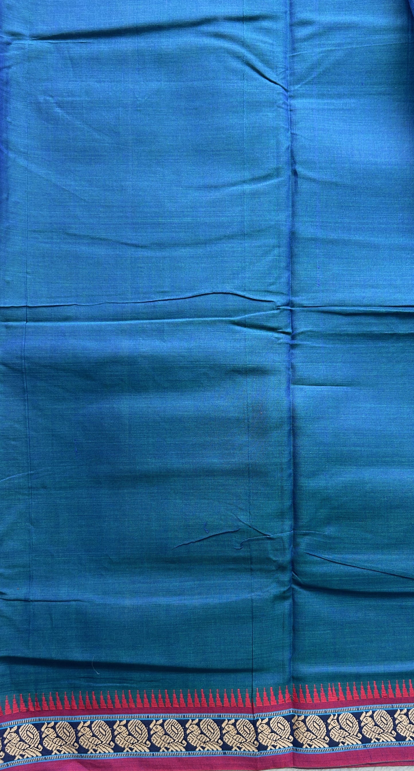 Narayanpet Cotton Saree Peacock Blue Colored Complemented with a Thread Border.