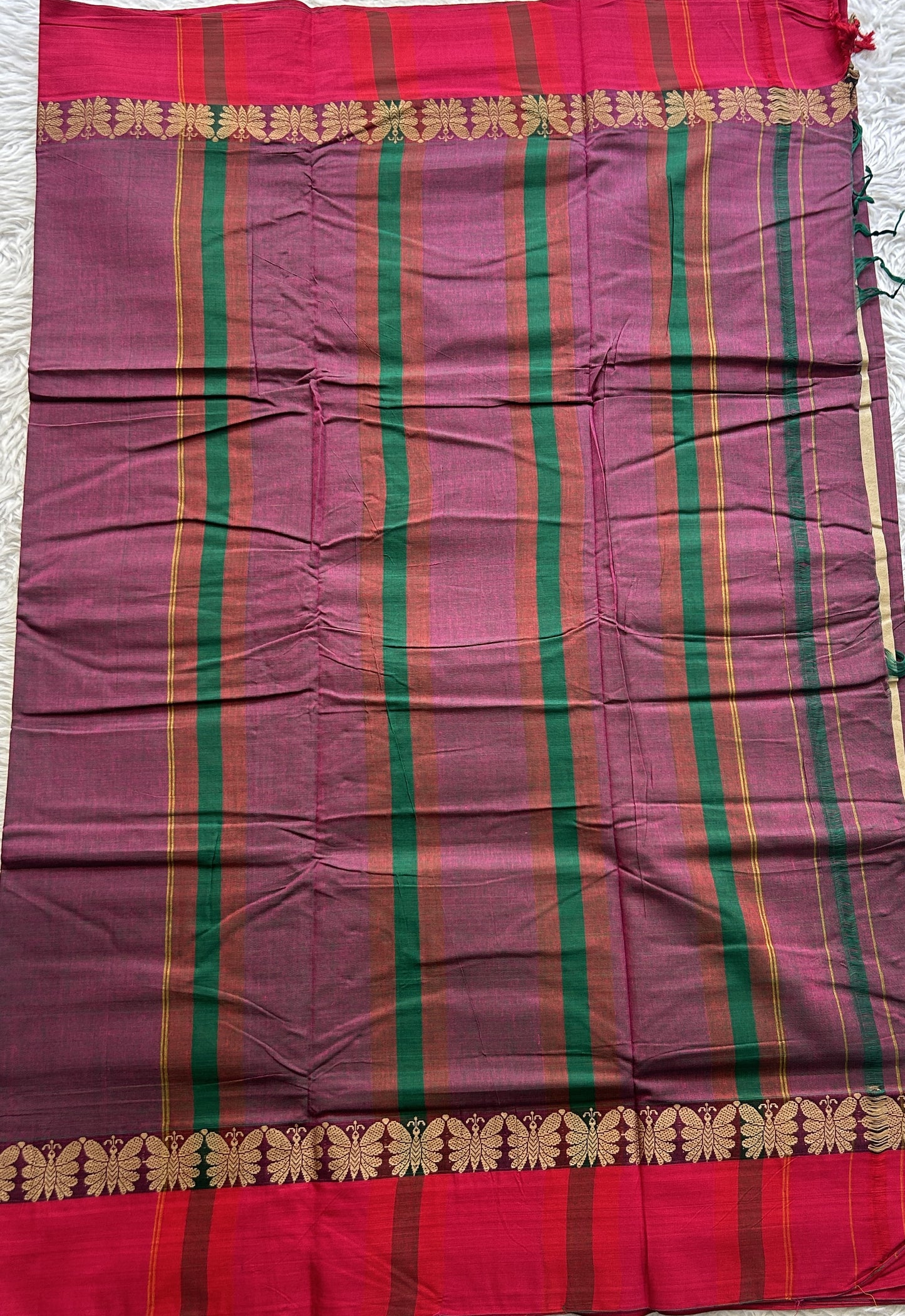 Narayanpet Cotton Saree Wine Colored Complemented with a Thread Border.