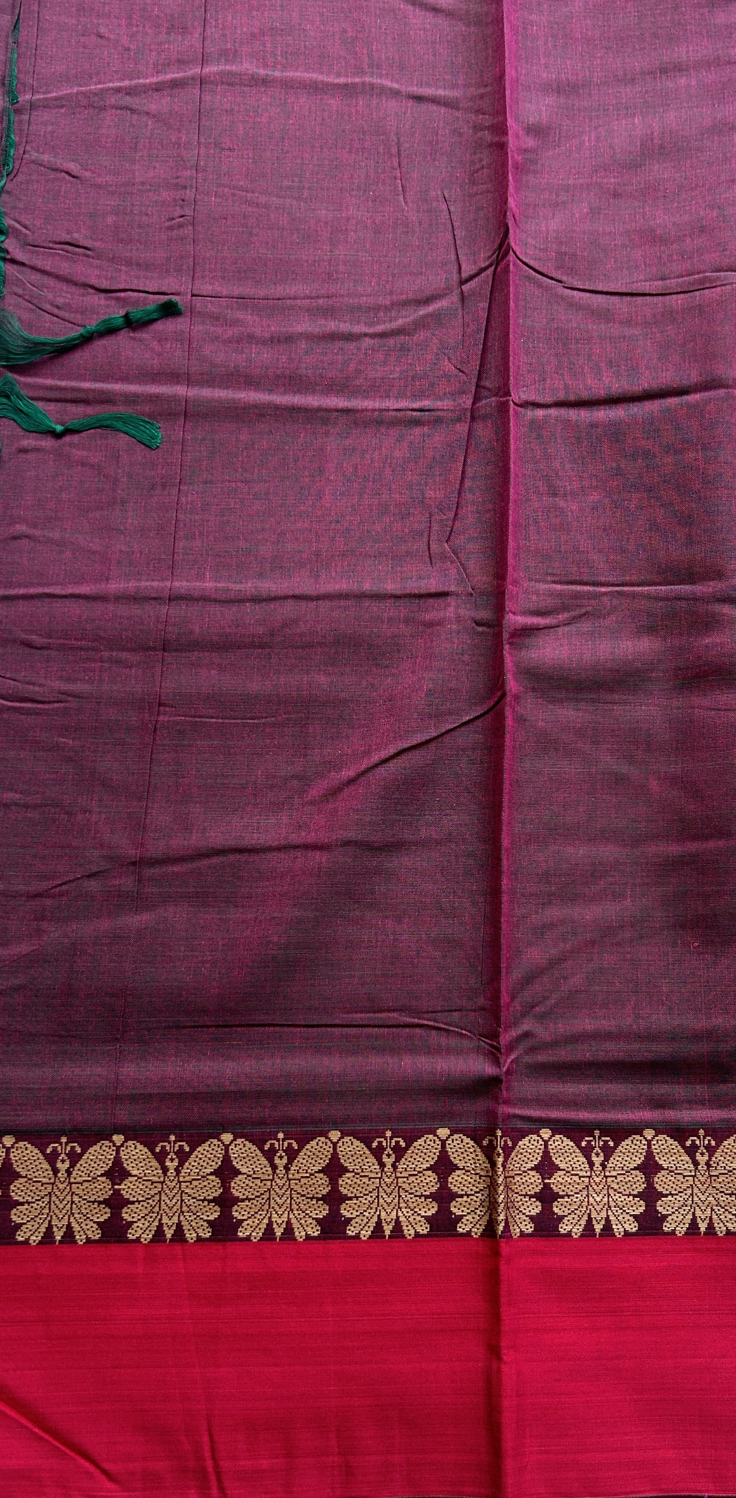 Narayanpet Cotton Saree Wine Colored Complemented with a Thread Border.