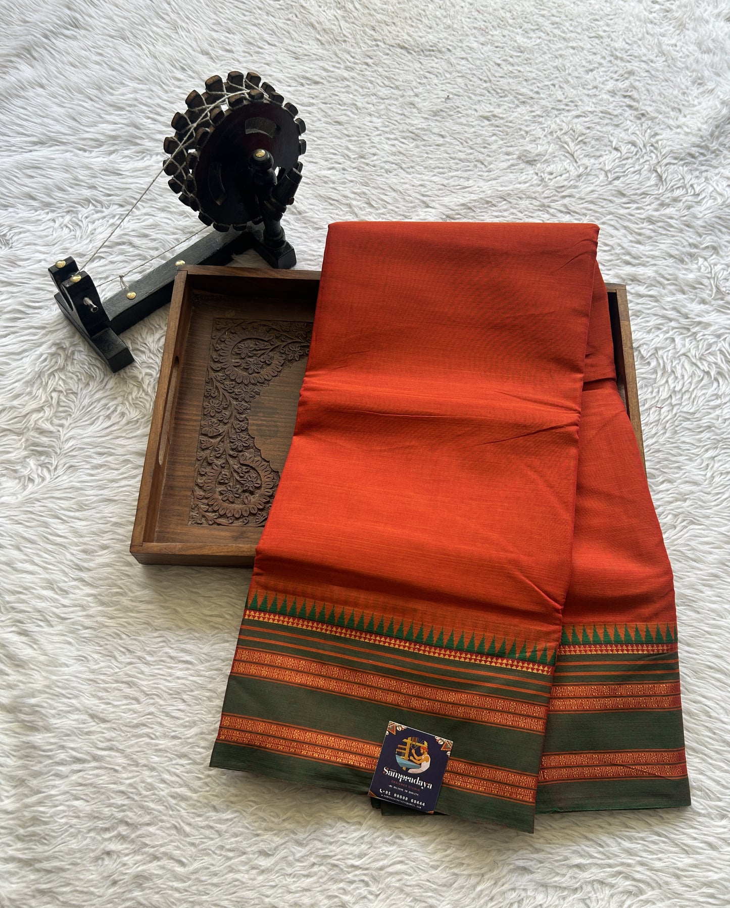 Narayanpet Cotton Saree Dark Orange Colored Complemented with a Thread Border.