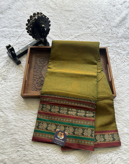 Narayanpet Cotton Saree Olive Green Colored Complemented with a Thread Border.