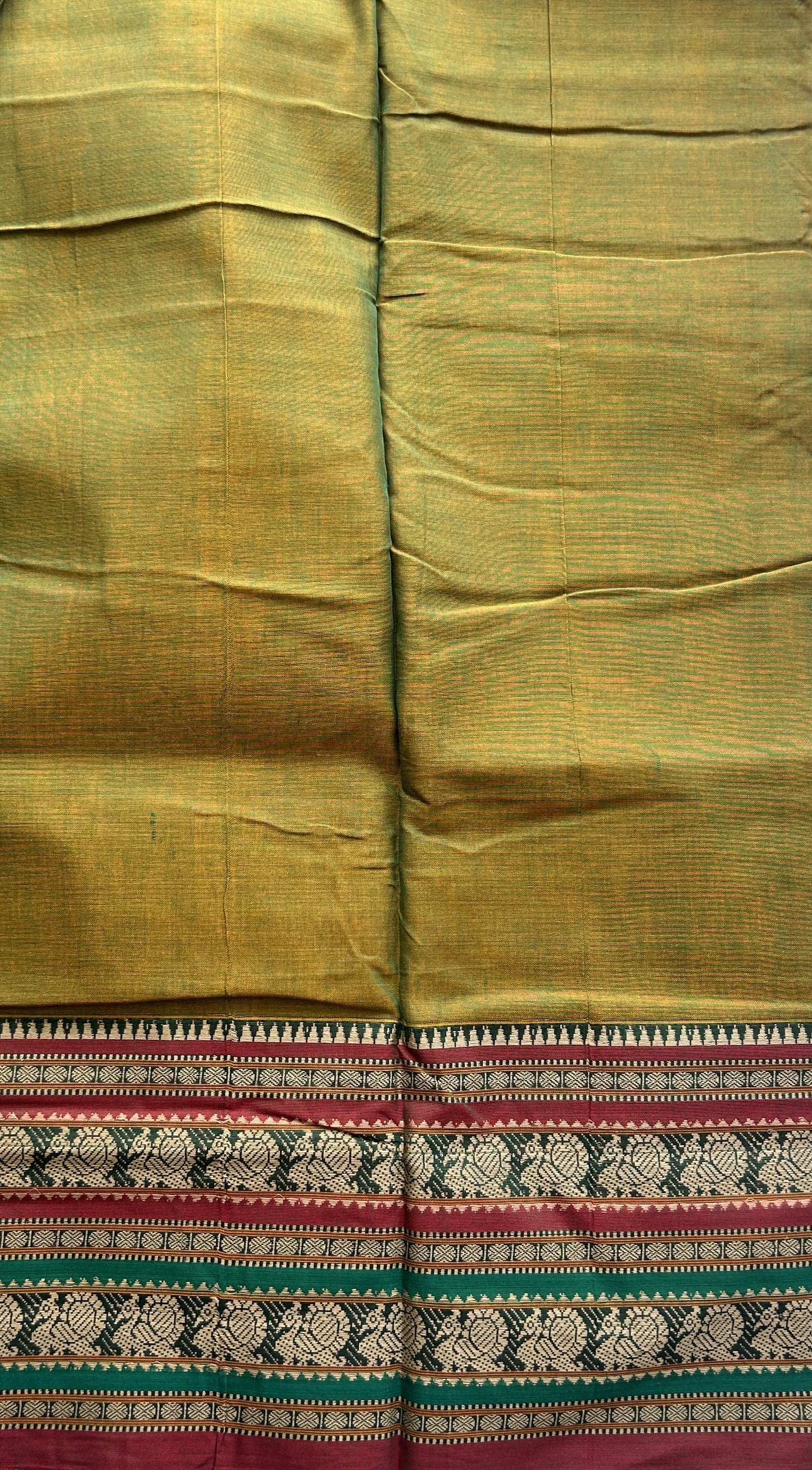 Narayanpet Cotton Saree Olive Green Colored Complemented with a Thread Border.