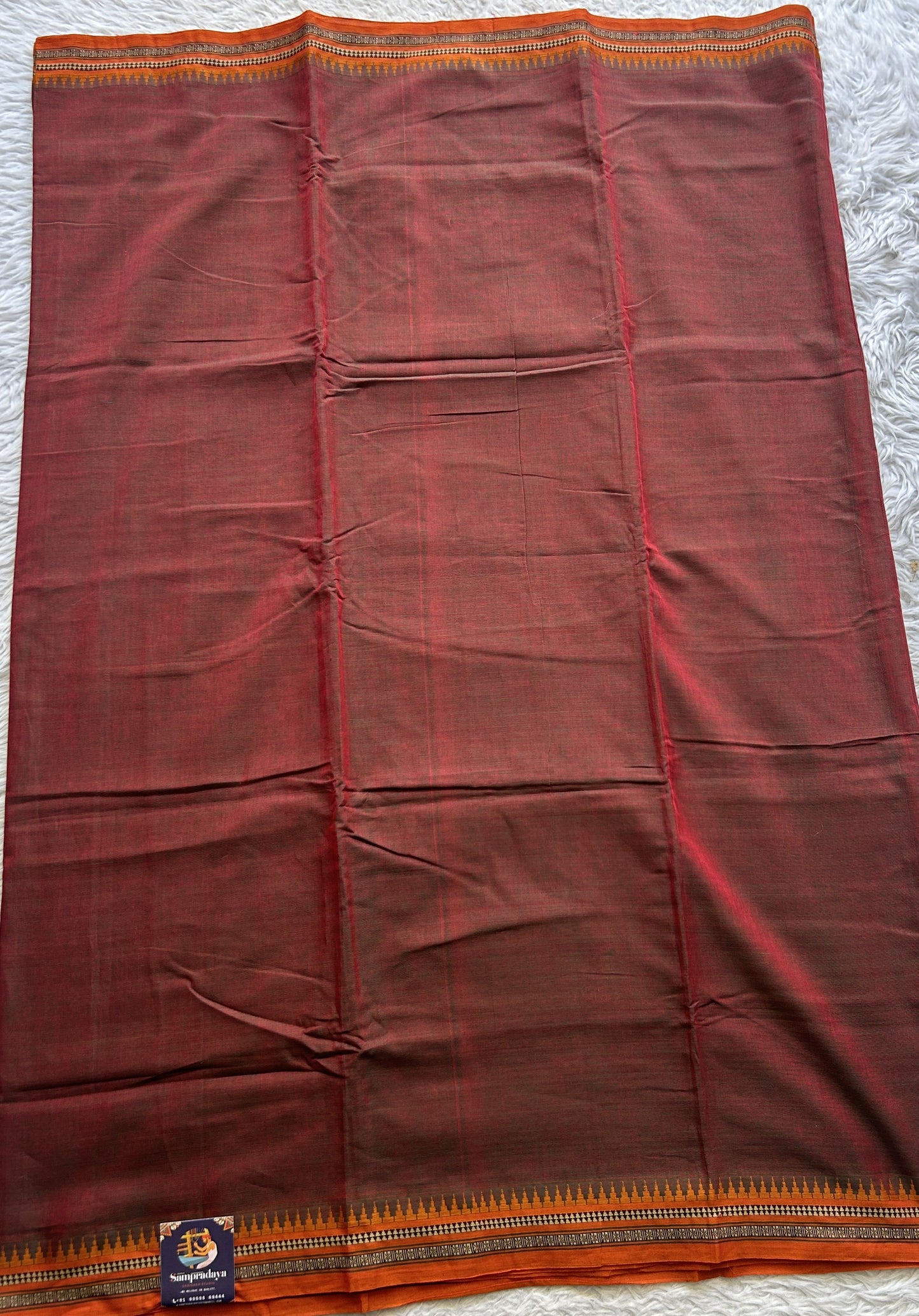 Narayanpet Cotton Saree Ginger Colored Complemented with a Thread Border.