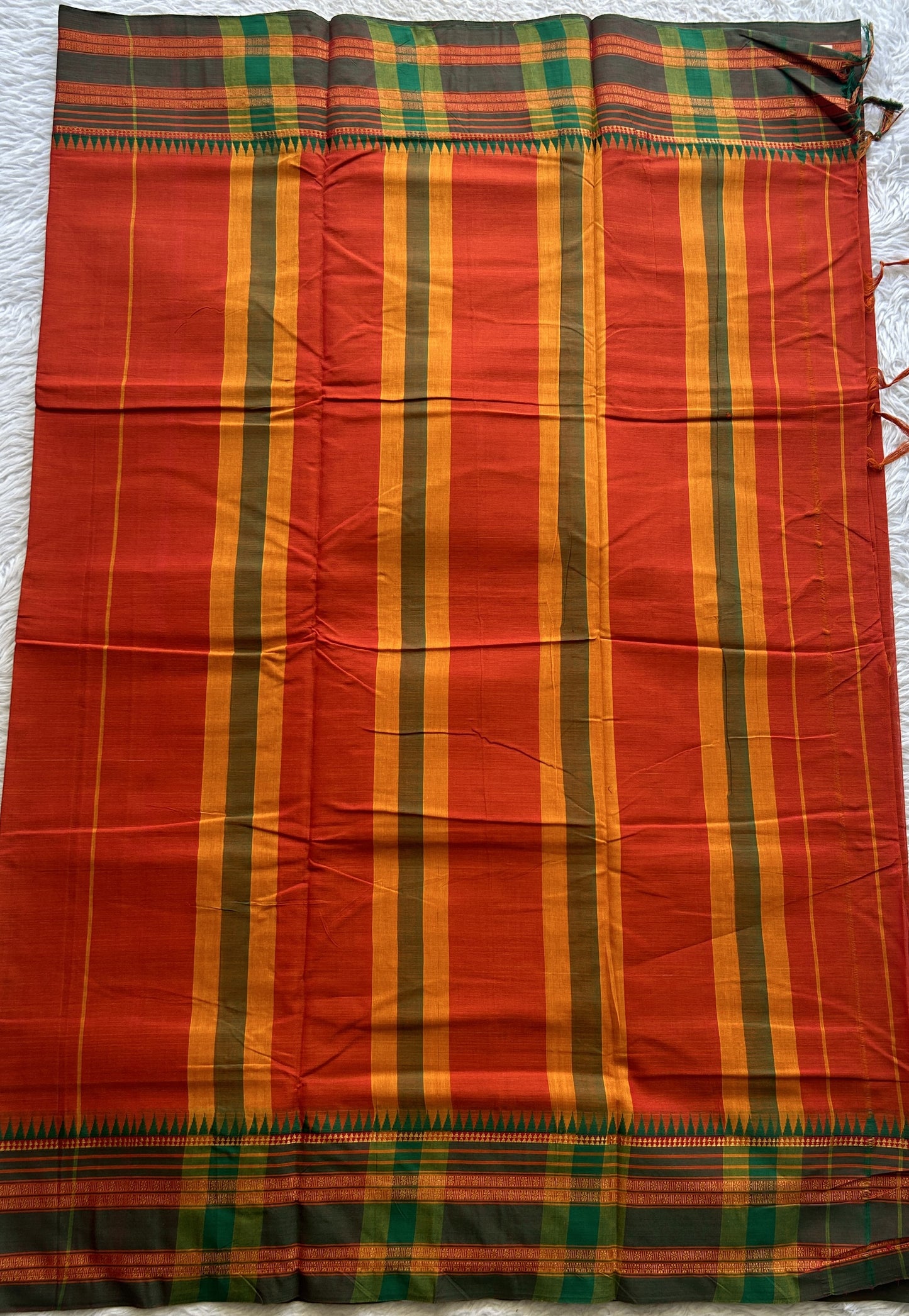 Narayanpet Cotton Saree Dark Orange Colored Complemented with a Thread Border.