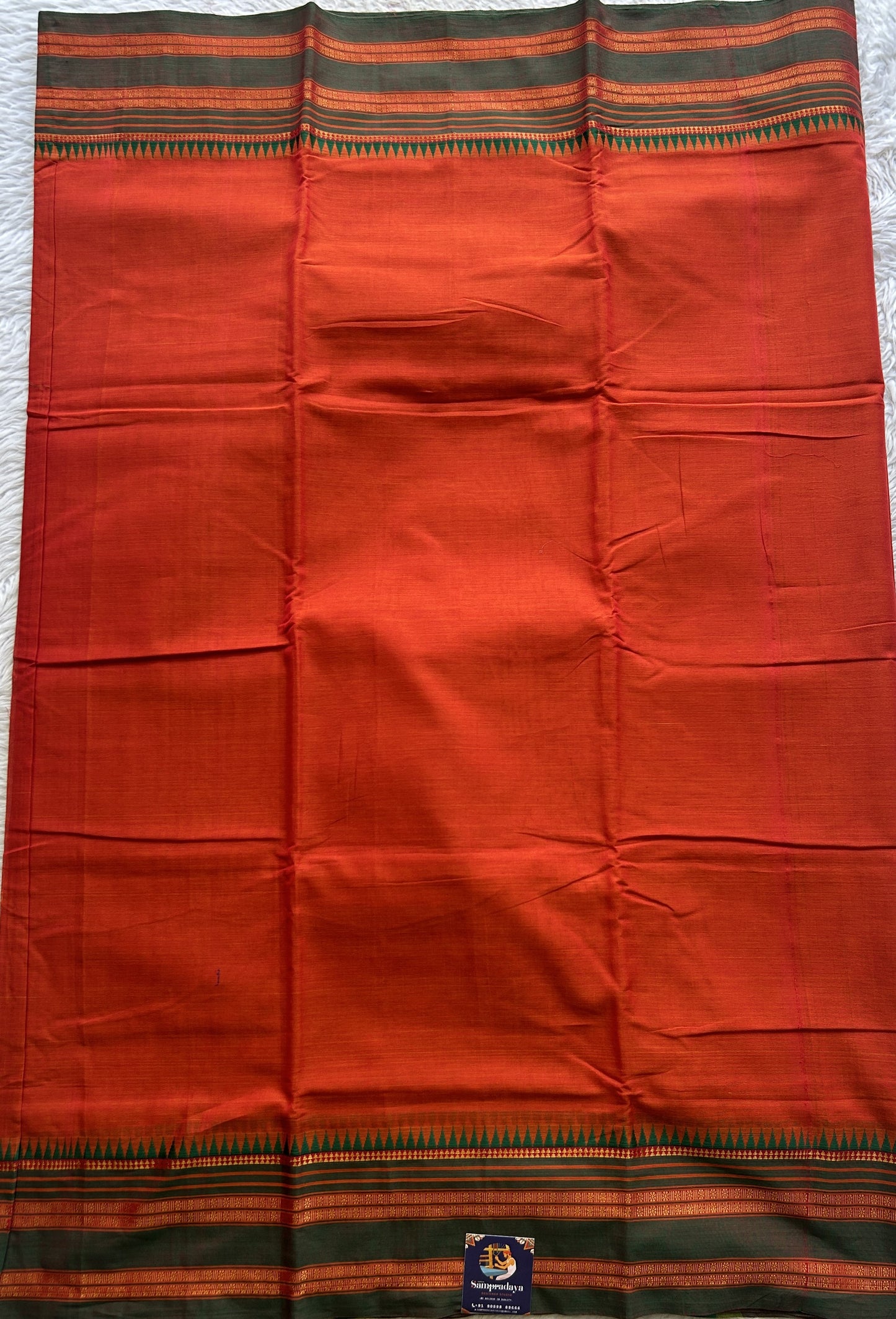 Narayanpet Cotton Saree Dark Orange Colored Complemented with a Thread Border.