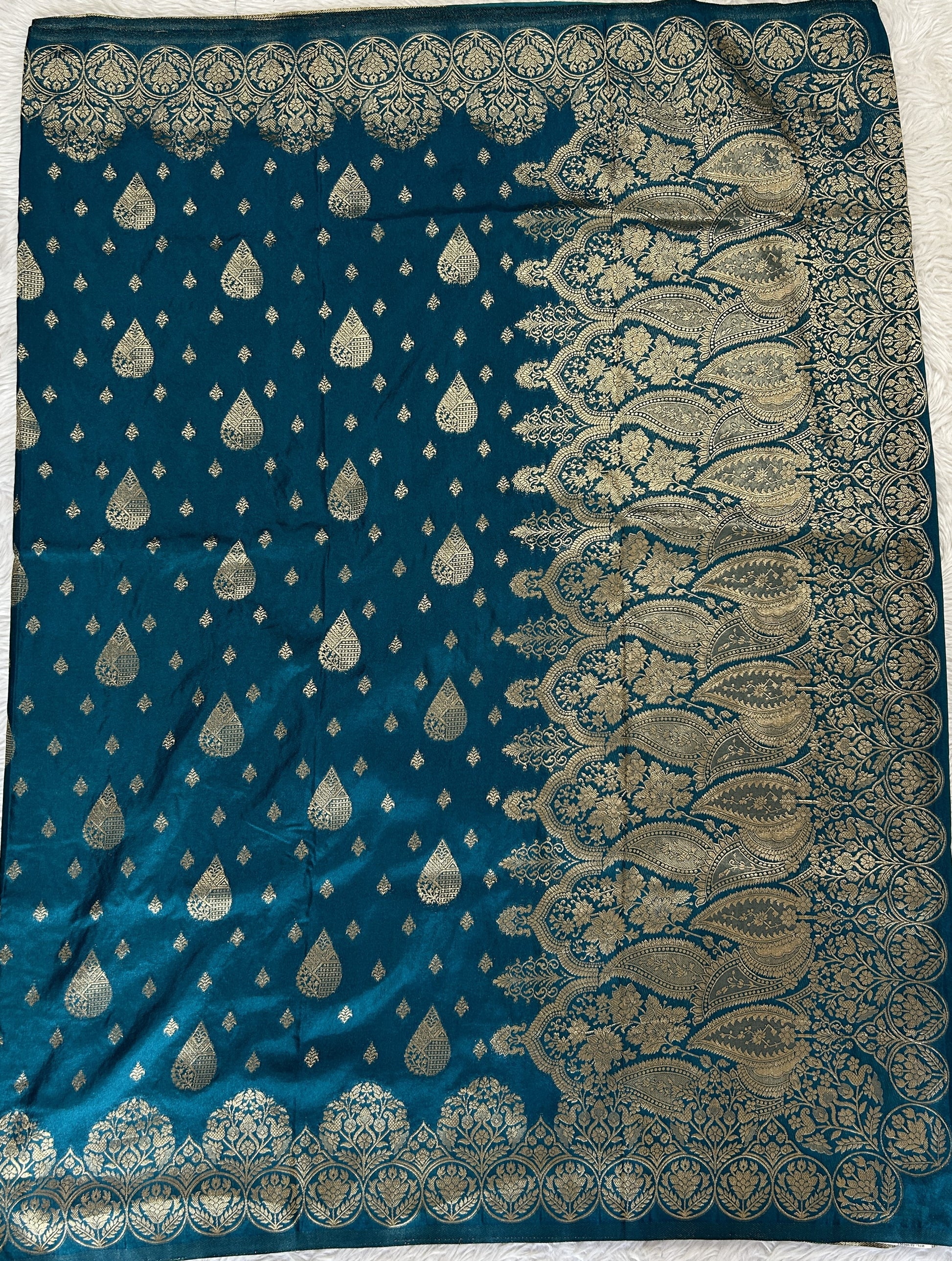 Banarasi Fancy Saree Peacock Blue Colored Complemented with a Zari Border. - Sampradaya Designer Studio