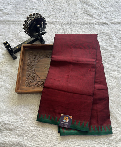 Narayanpet Cotton Saree Dark Maroon Colored Complemented with a Green Thread Border.