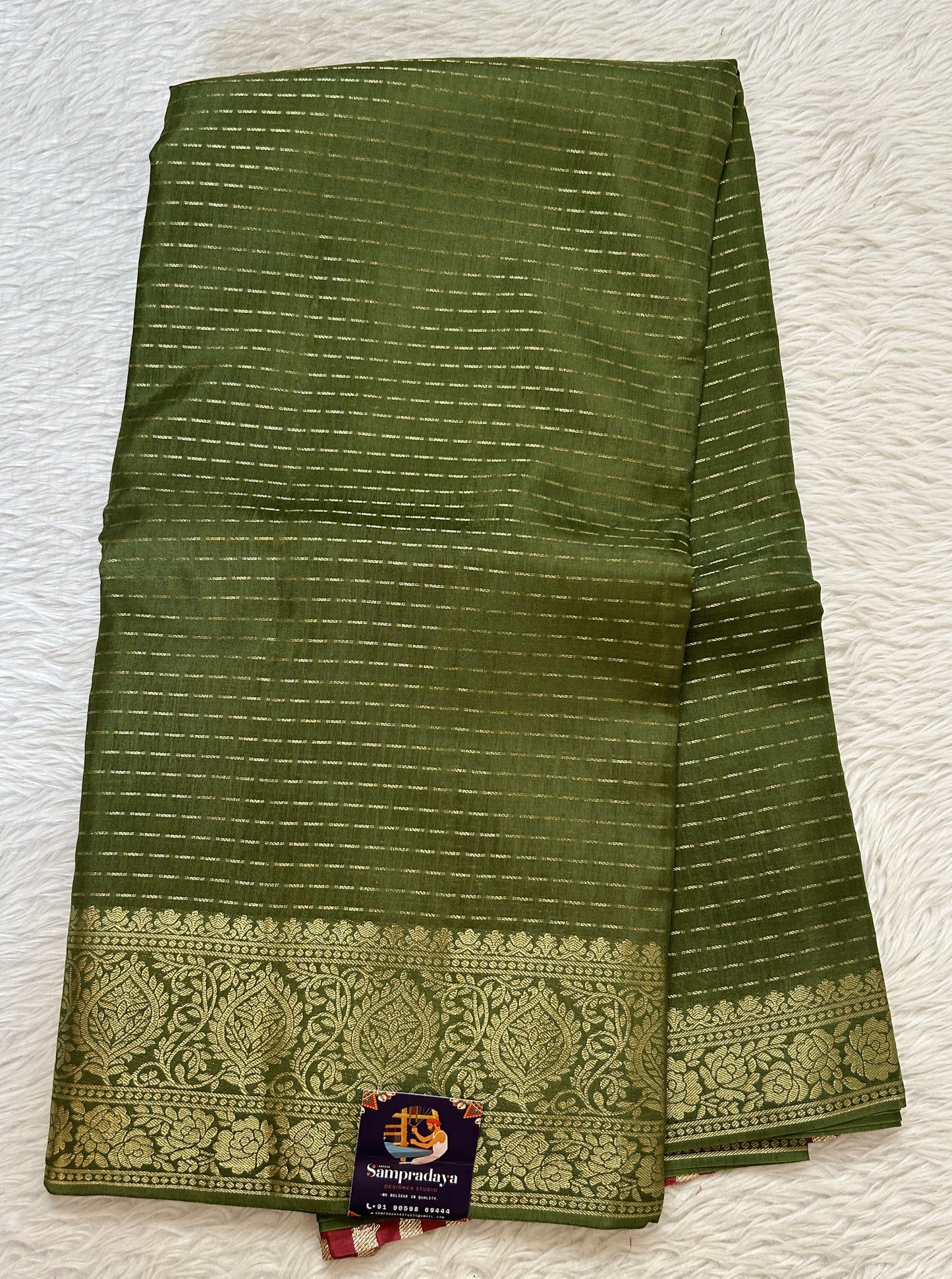 Banarasi Fancy Saree Green Colored Complemented with a Zari Border. - Sampradaya Designer Studio