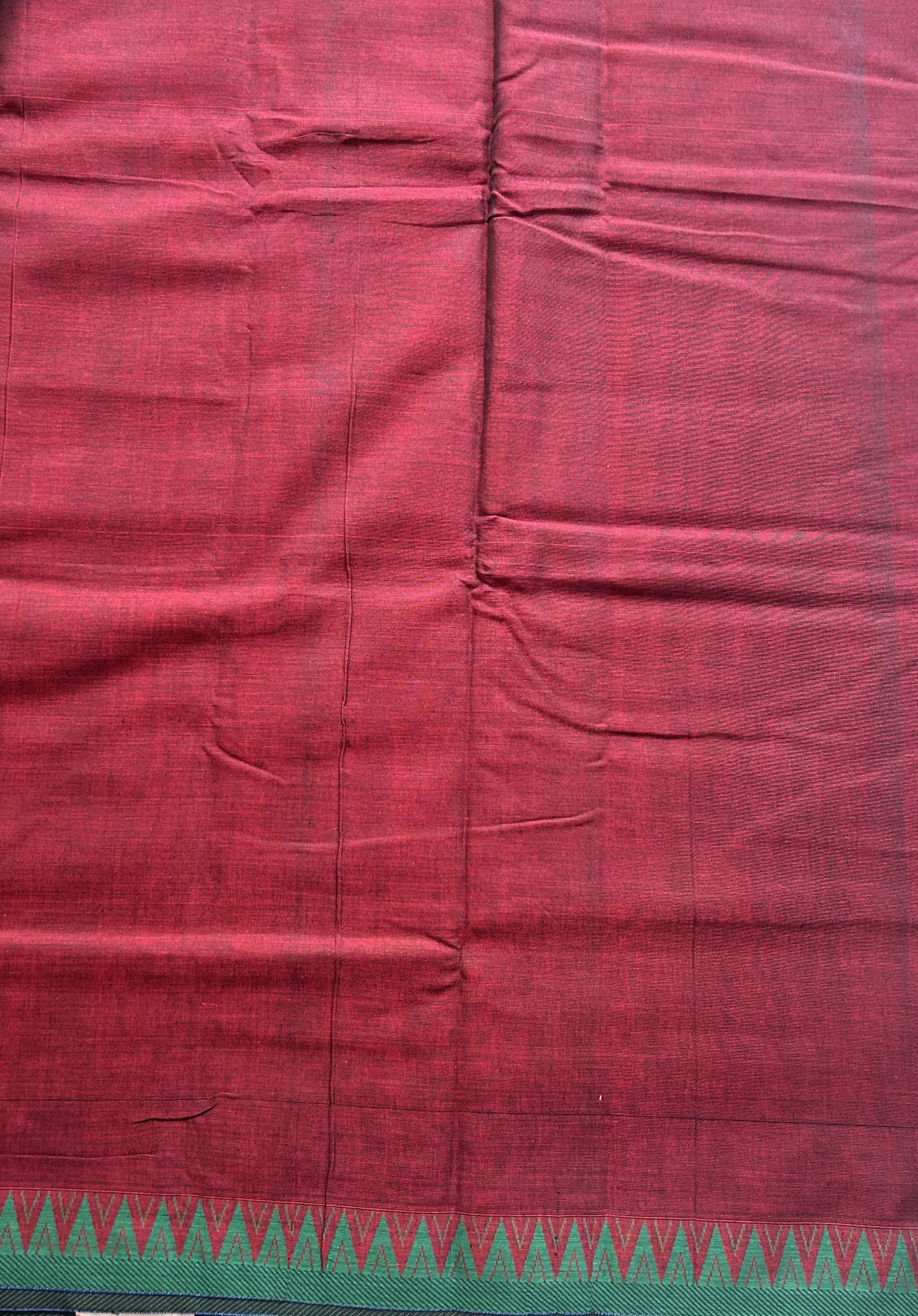 Narayanpet Cotton Saree Dark Maroon Colored Complemented with a Green Thread Border.