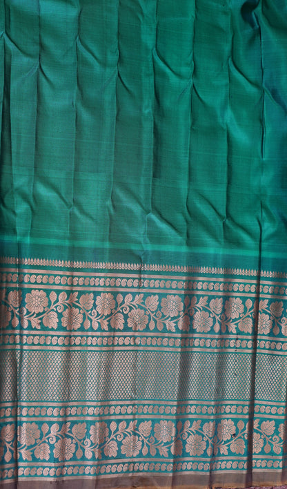 Gadwal Silk Saree Navy Blue Colored Complemented With a Green Color Zari Border