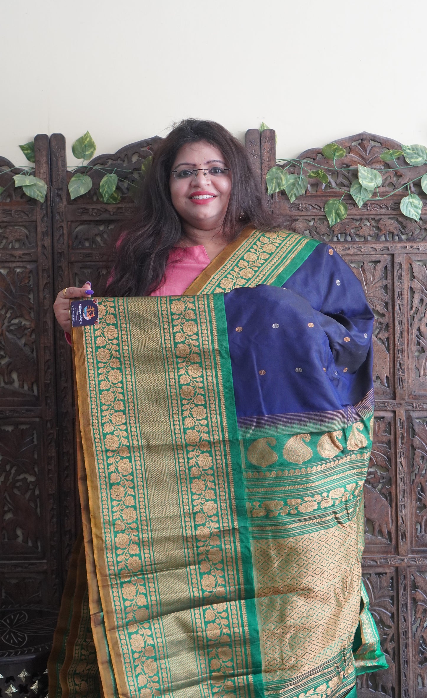 Gadwal Silk Saree Navy Blue Colored Complemented With a Green Color Zari Border