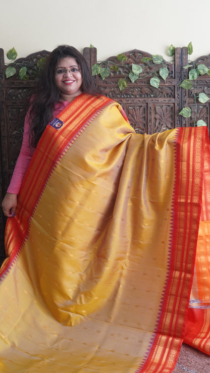 Gadwal Silk Saree Dark Yellow Colored Complemented With a Red Color Zari Border