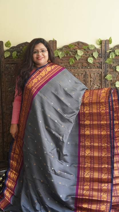 Gadwal Silk Saree Gray Colored Complemented With a Zari Border