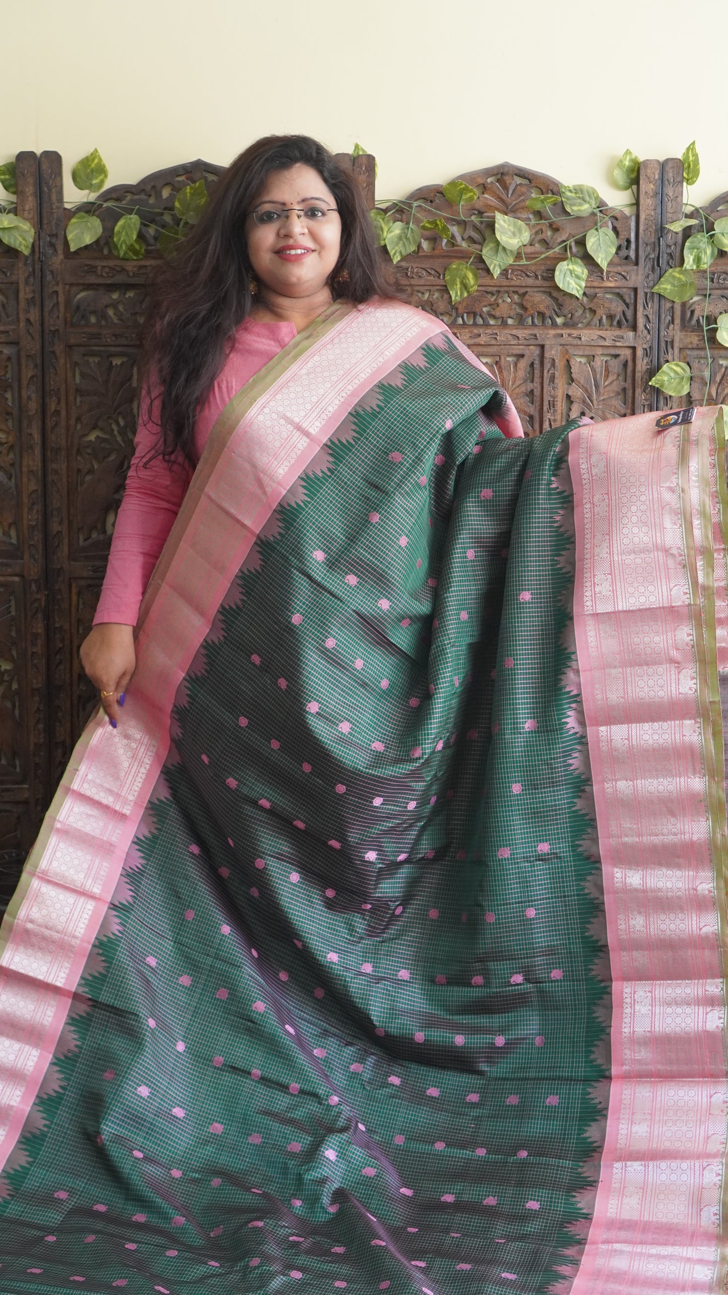 Gadwal Silk Saree Bottle Green Colored Complemented With a Zari Border