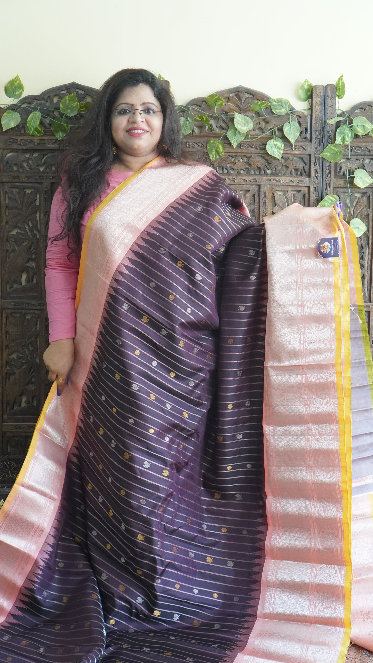 Gadwal Silk Saree Brown Colored Complemented With a Peach Zari Border