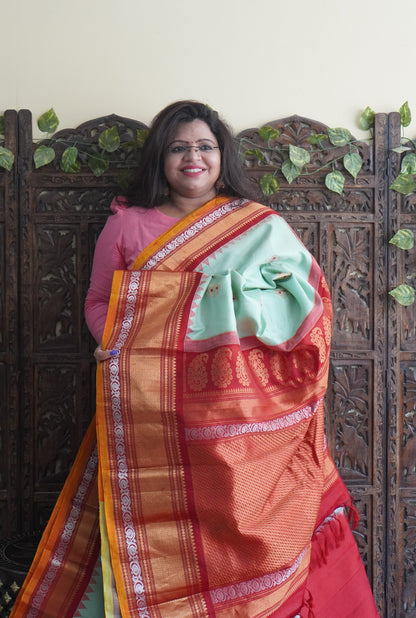 Gadwal Silk Saree Light Green Colored Complemented With a Red Zari Border