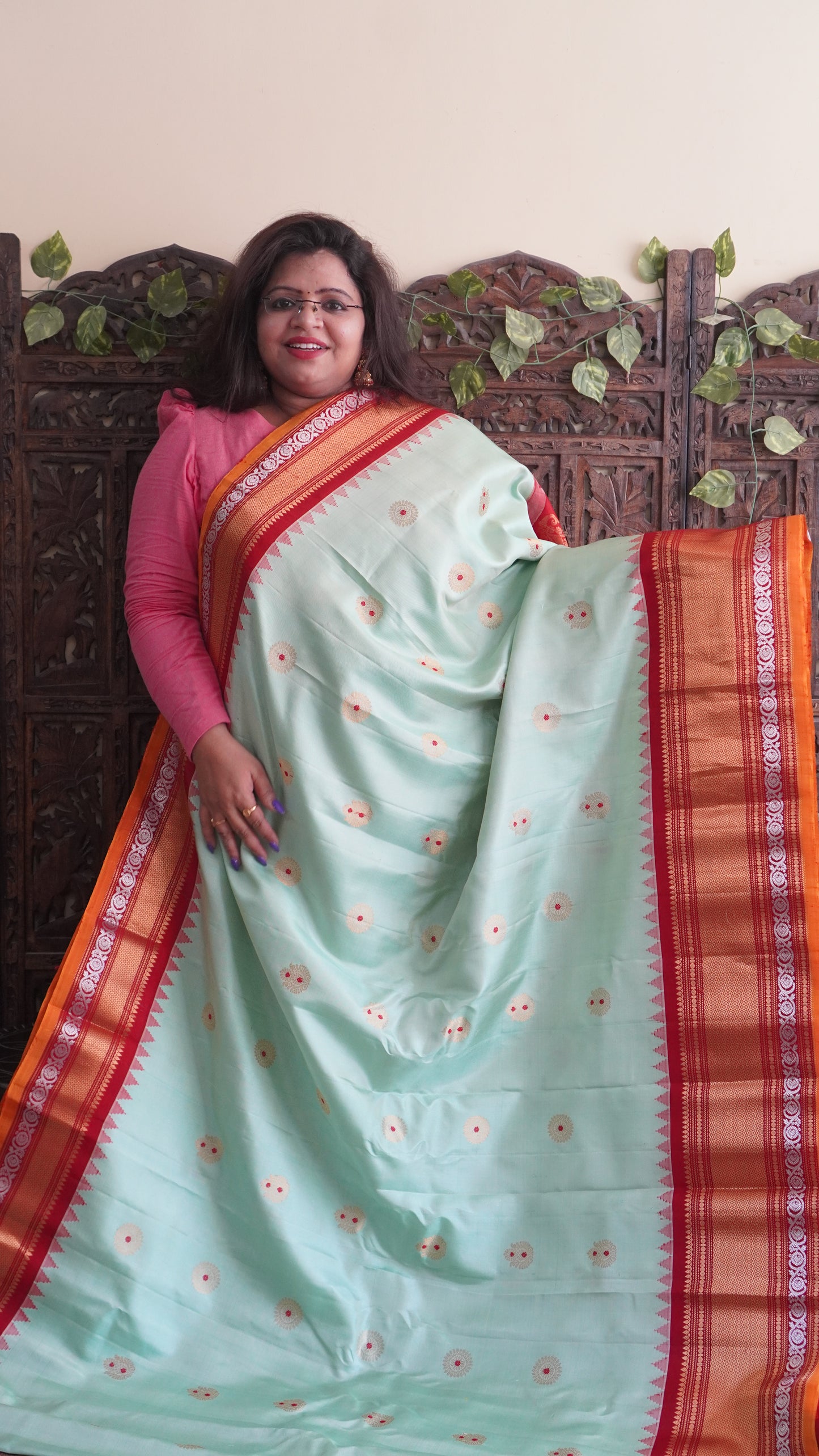 Gadwal Silk Saree Light Green Colored Complemented With a Red Zari Border