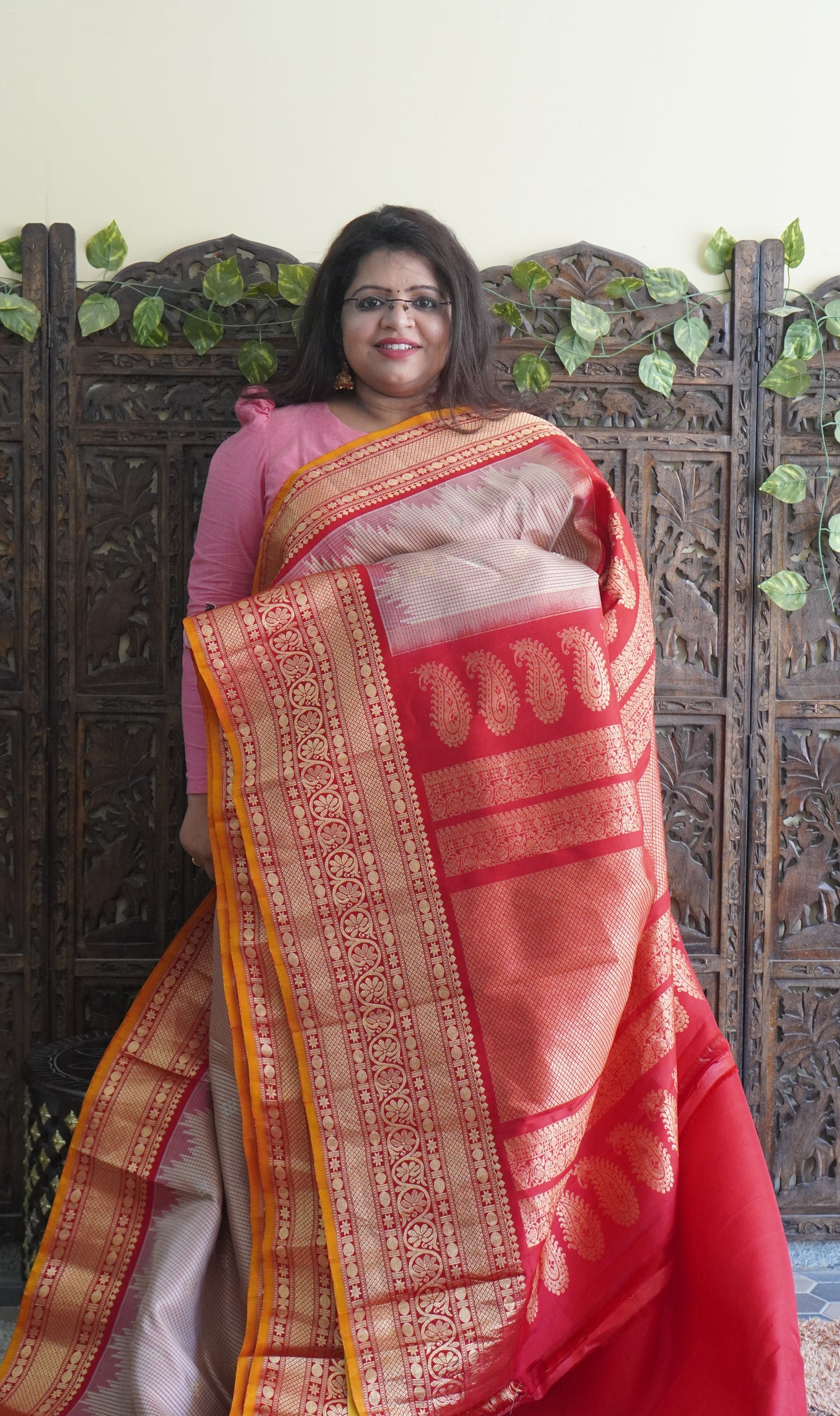 Gadwal Silk Saree Cream Colored Complemented With a Red Zari Border