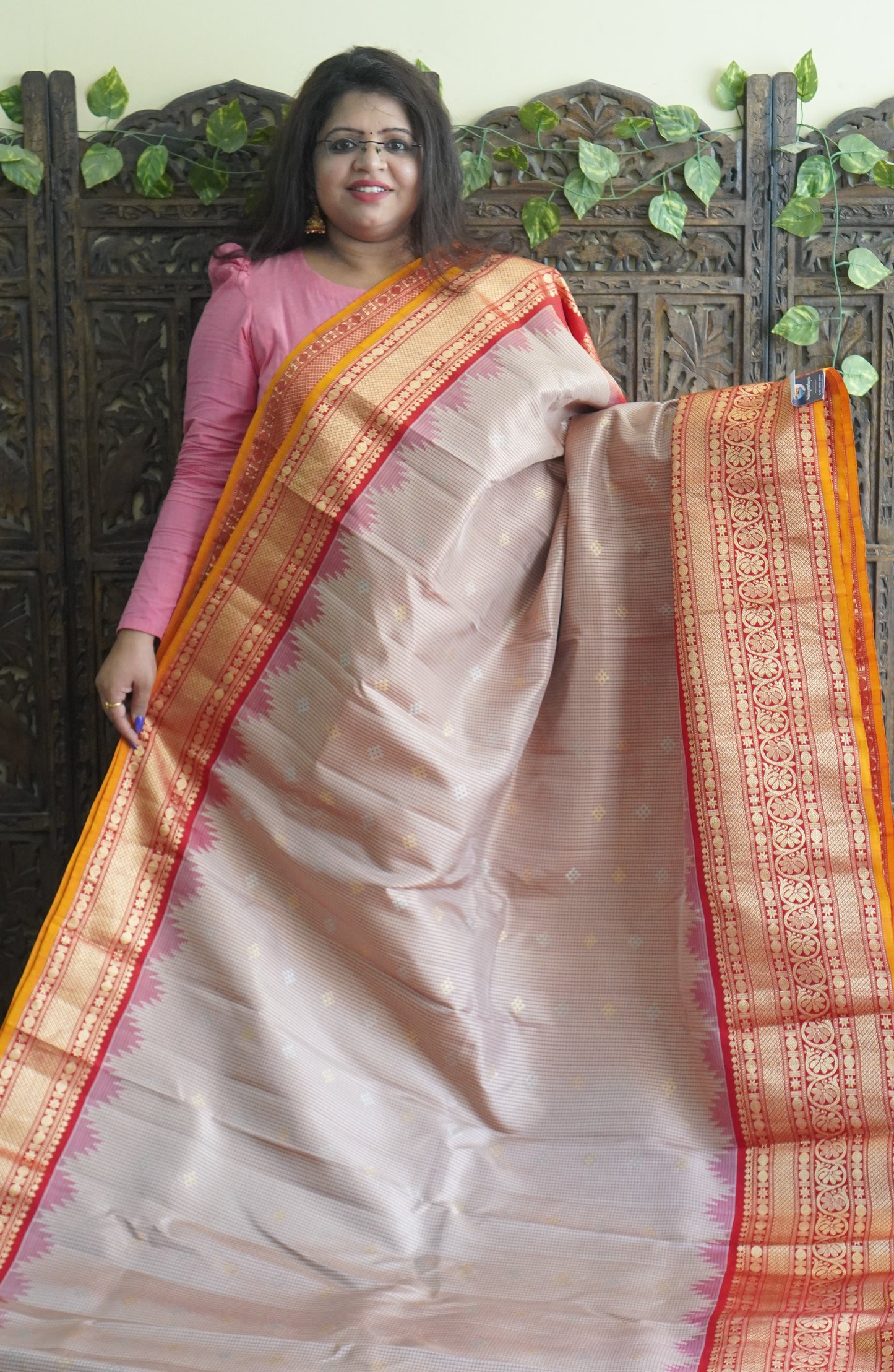 Gadwal Silk Saree Cream Colored Complemented With a Red Zari Border