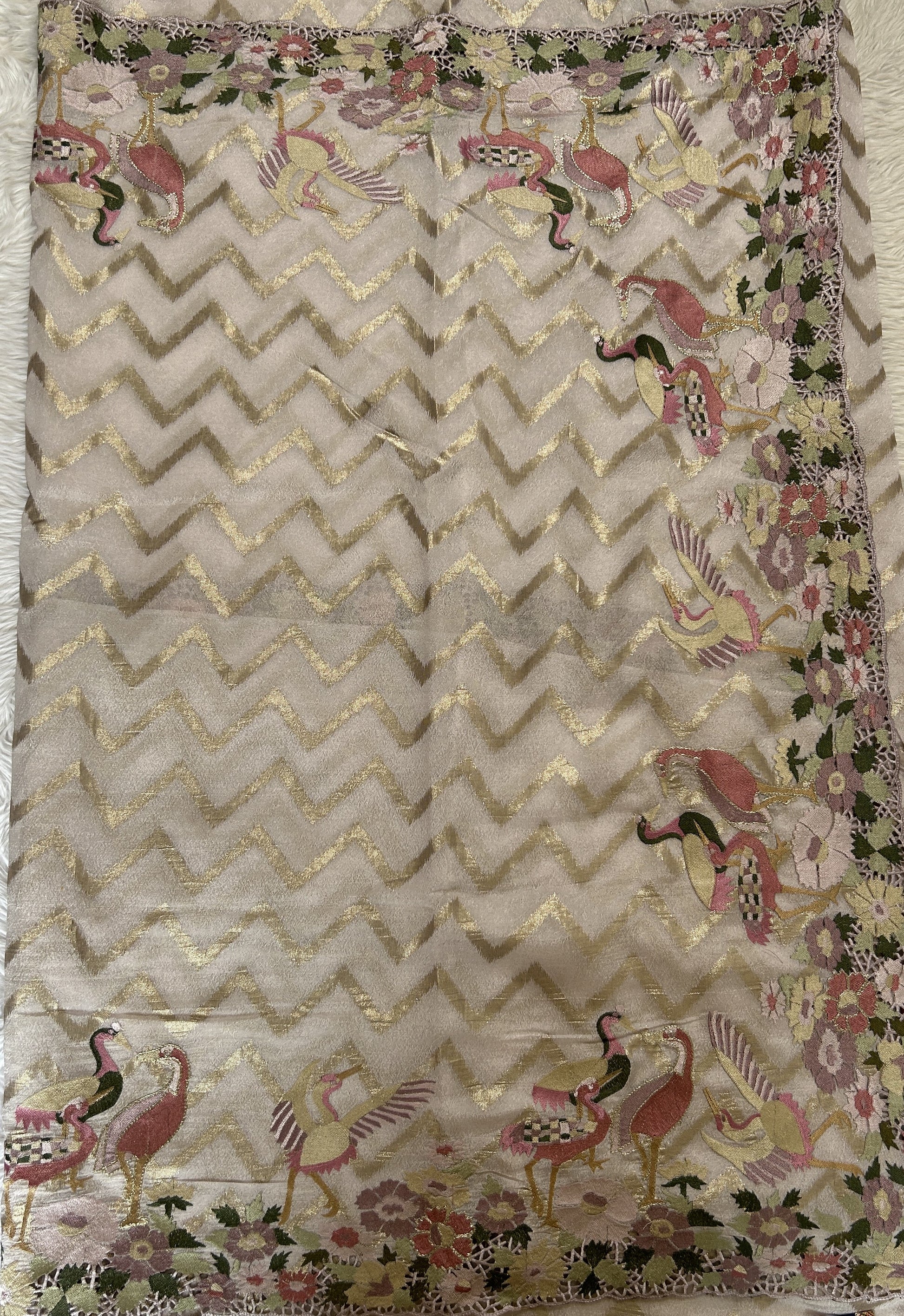 Tissue Georgette Designer Saree Cream colored complemented with a Cutwork border. - Sampradaya Designer Studio