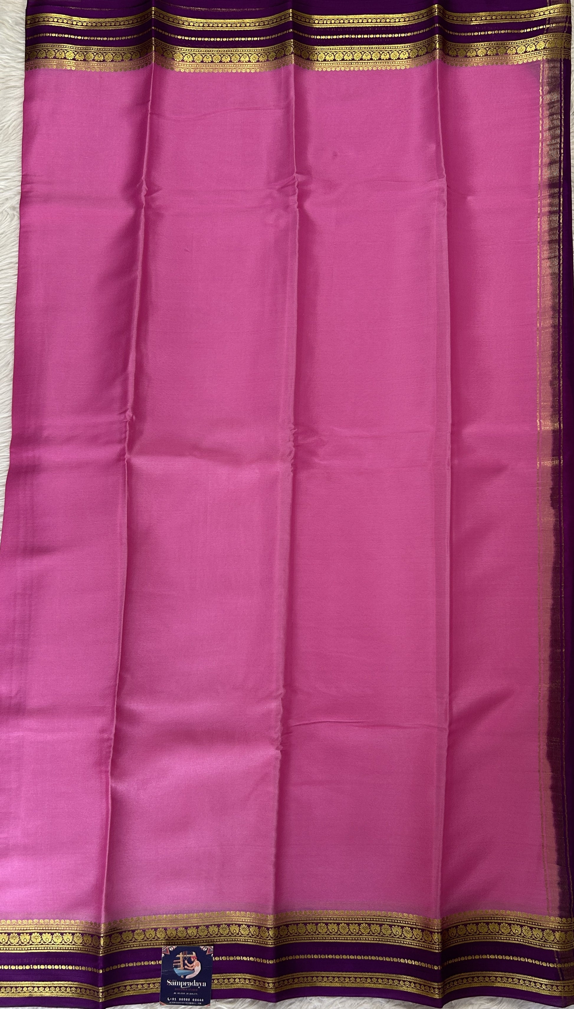 Mysore Crepe Silk Saree Pink Colored Complemented with a Purple Zari Border. - Sampradaya Designer Studio