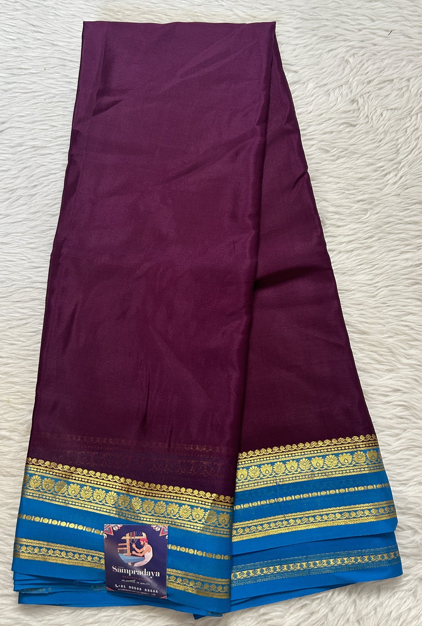 Mysore Crepe Silk Saree Purple Colored Complemented with a Blue Zari Border. - Sampradaya Designer Studio