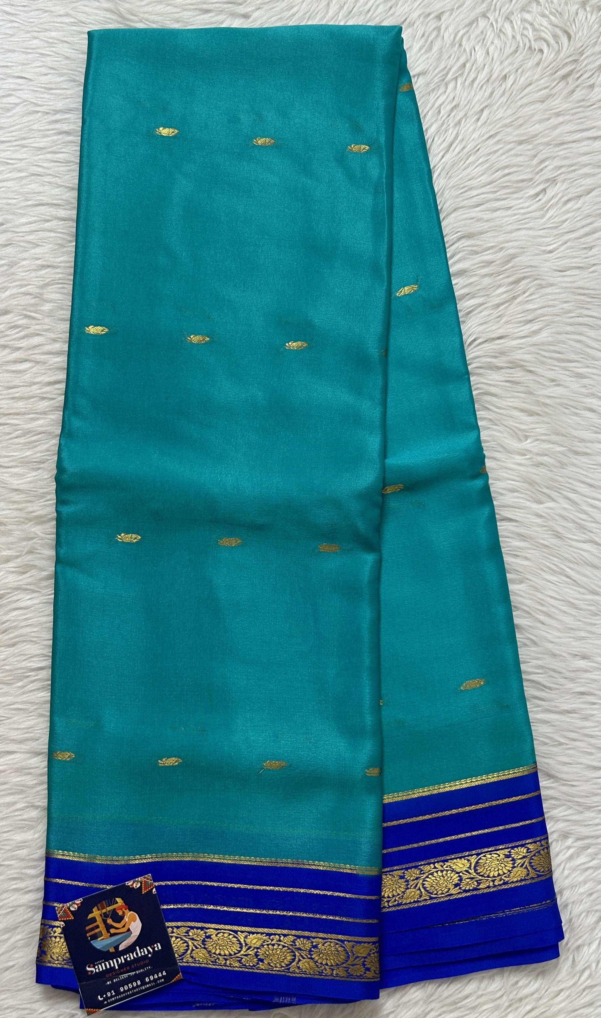 Mysore Crepe Silk Saree Sea Blue Colored Complemented with a Blue Zari Border. - Sampradaya Designer Studio