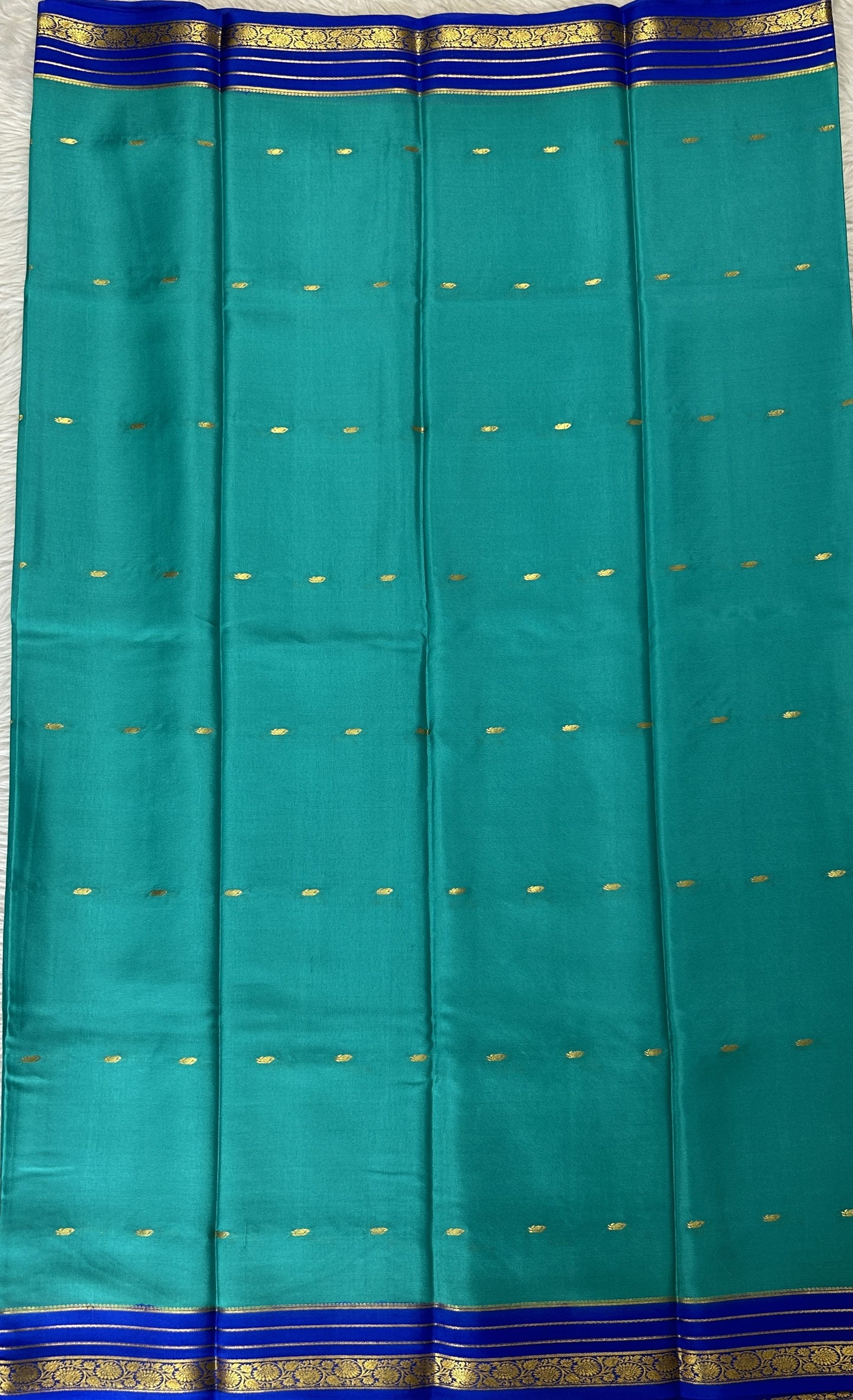 Mysore Crepe Silk Saree Sea Blue Colored Complemented with a Blue Zari Border. - Sampradaya Designer Studio