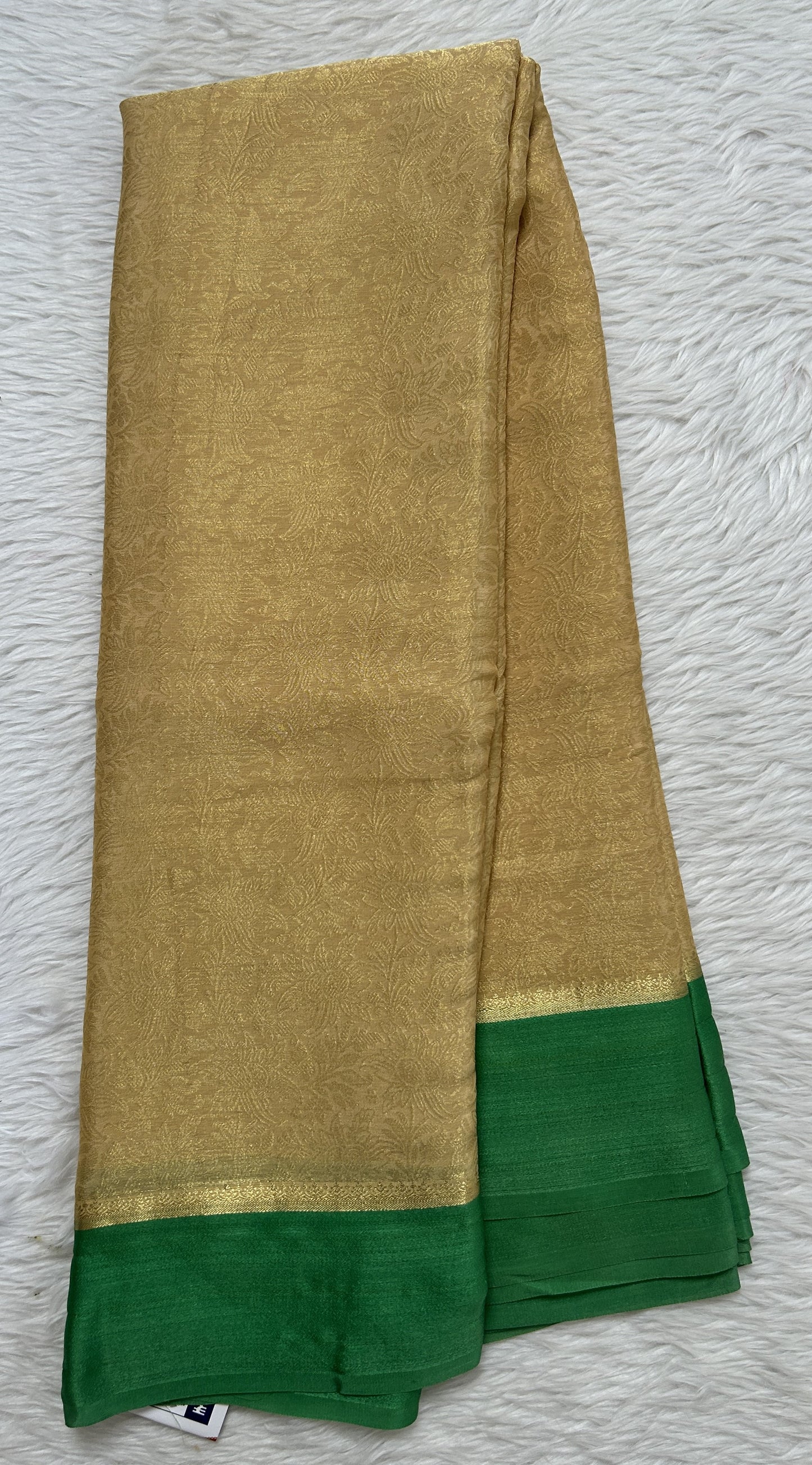 Mysore Crepe Silk Saree Cream Colored Complemented with a Green Zari Border. - Sampradaya Designer Studio