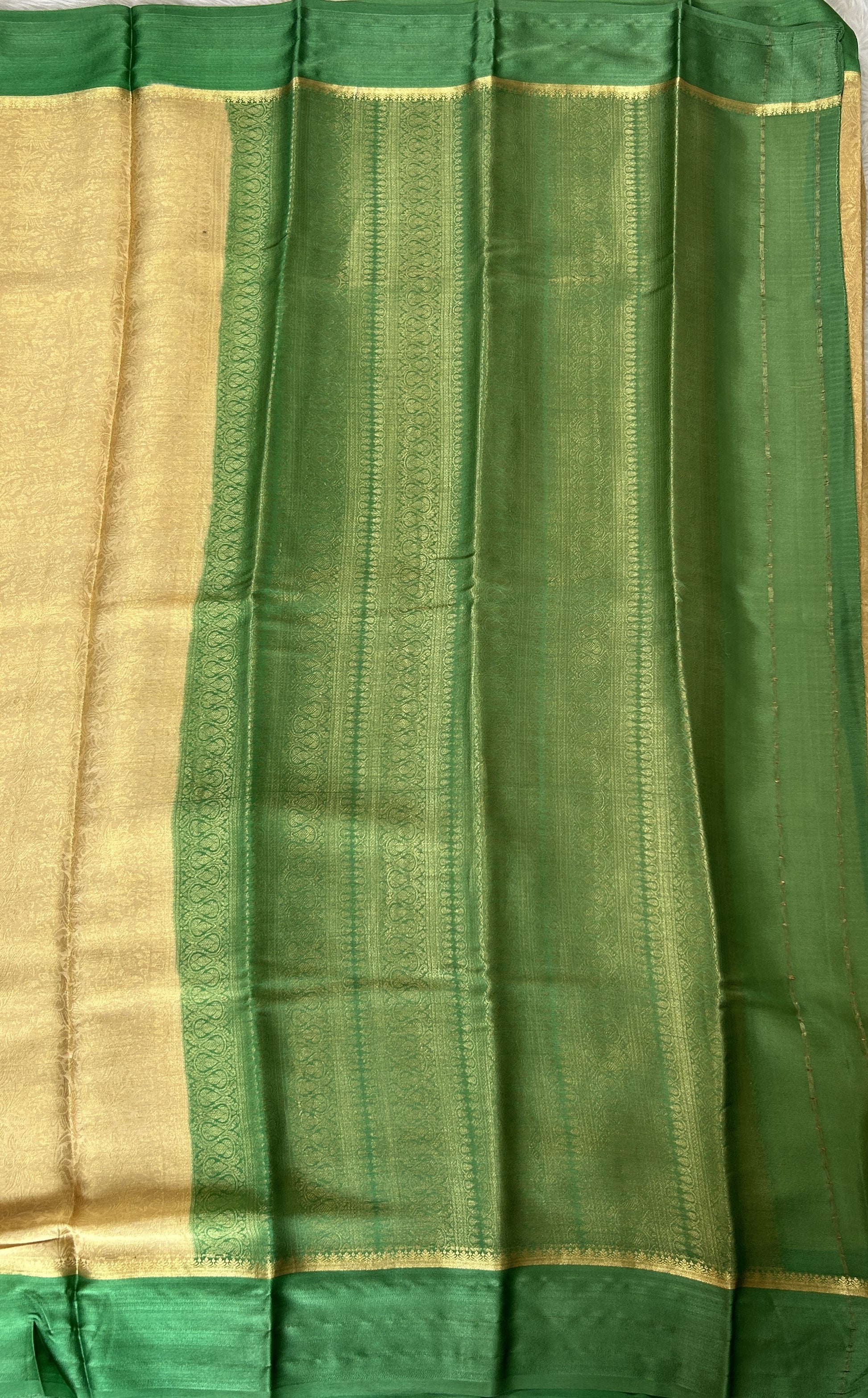 Mysore Crepe Silk Saree Cream Colored Complemented with a Green Zari Border. - Sampradaya Designer Studio