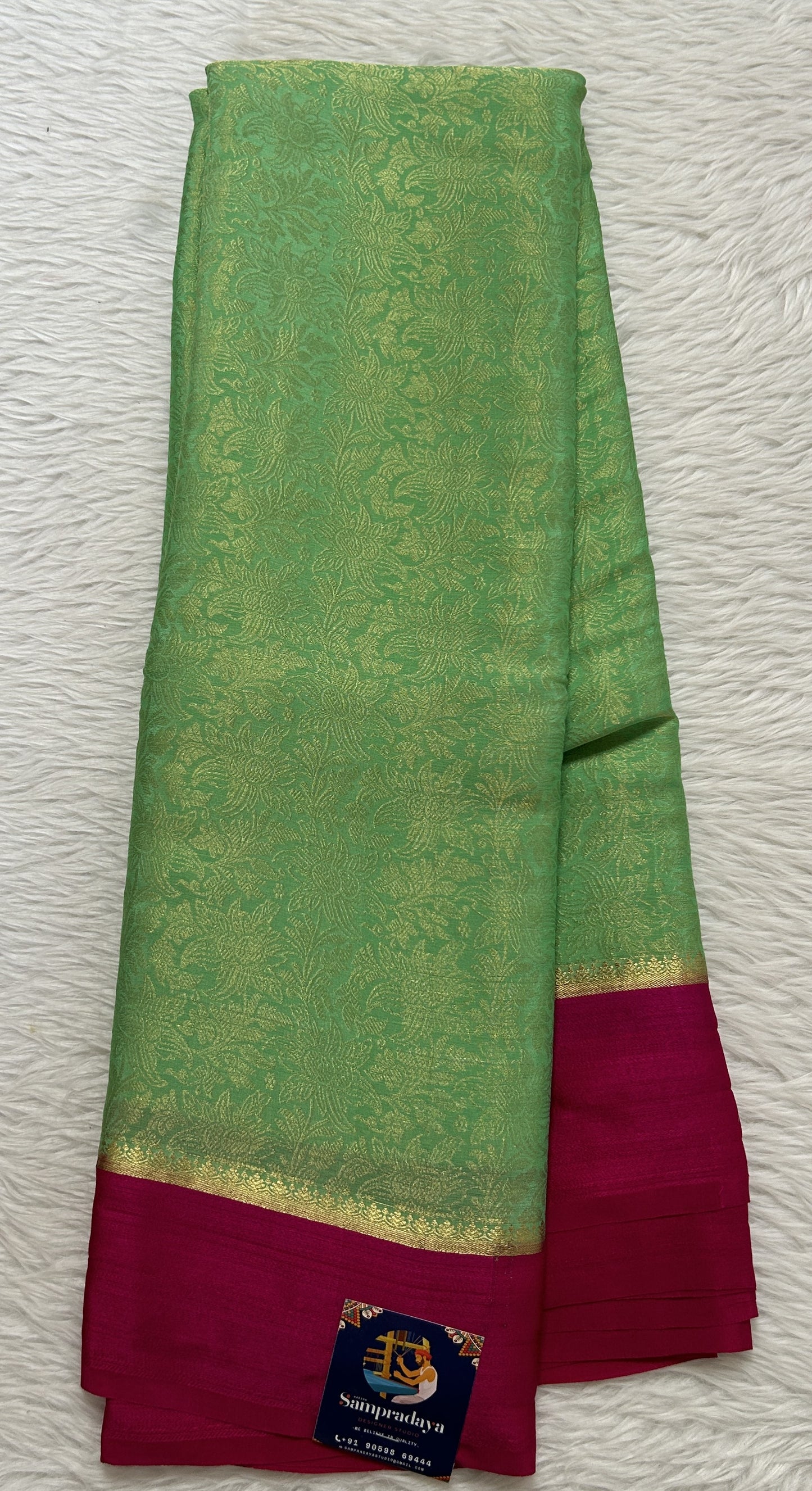 Mysore Crepe Silk Saree Green Colored Complemented with a Pink Zari Border. - Sampradaya Designer Studio