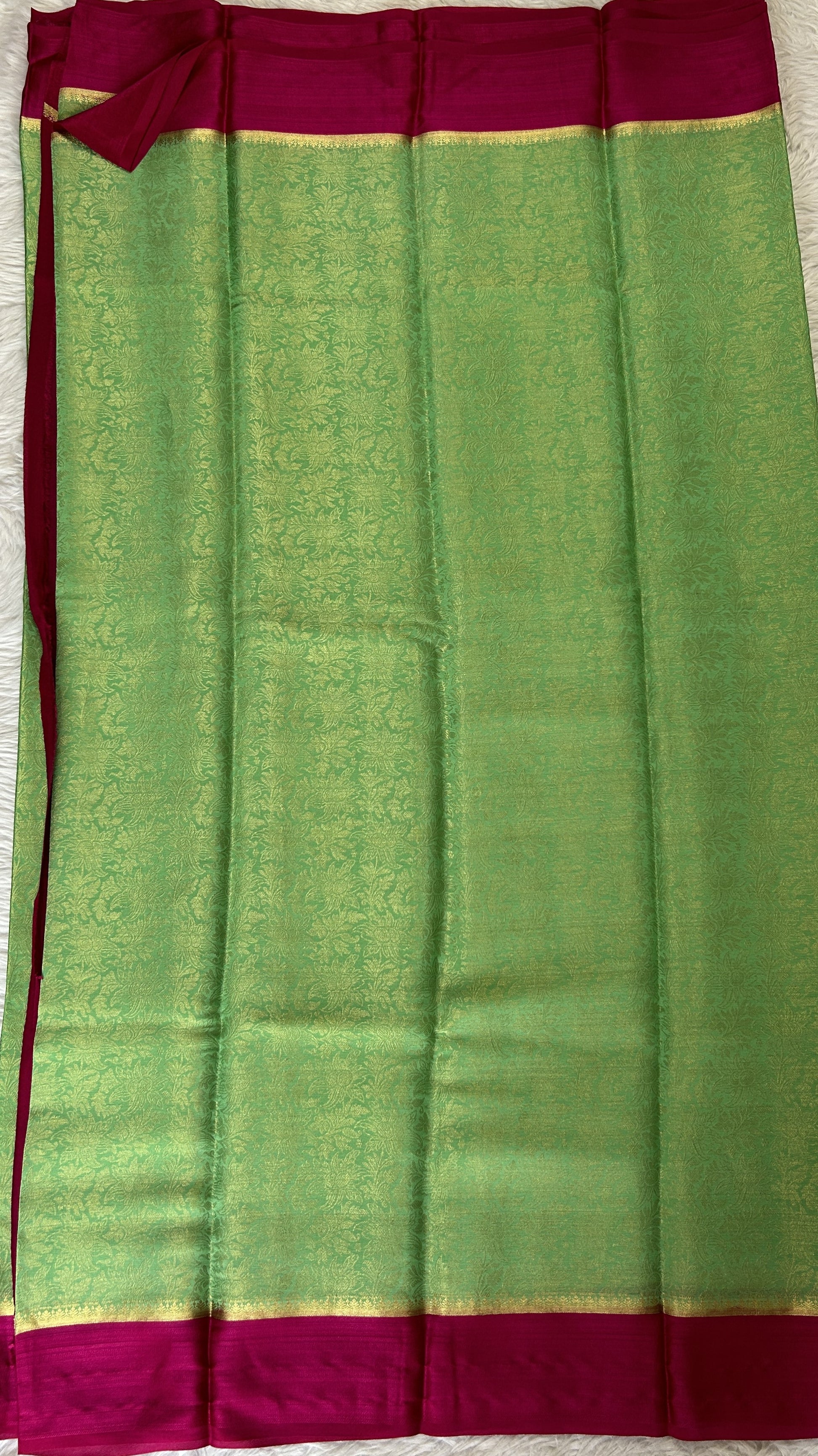 Mysore Crepe Silk Saree Green Colored Complemented with a Pink Zari Border. - Sampradaya Designer Studio