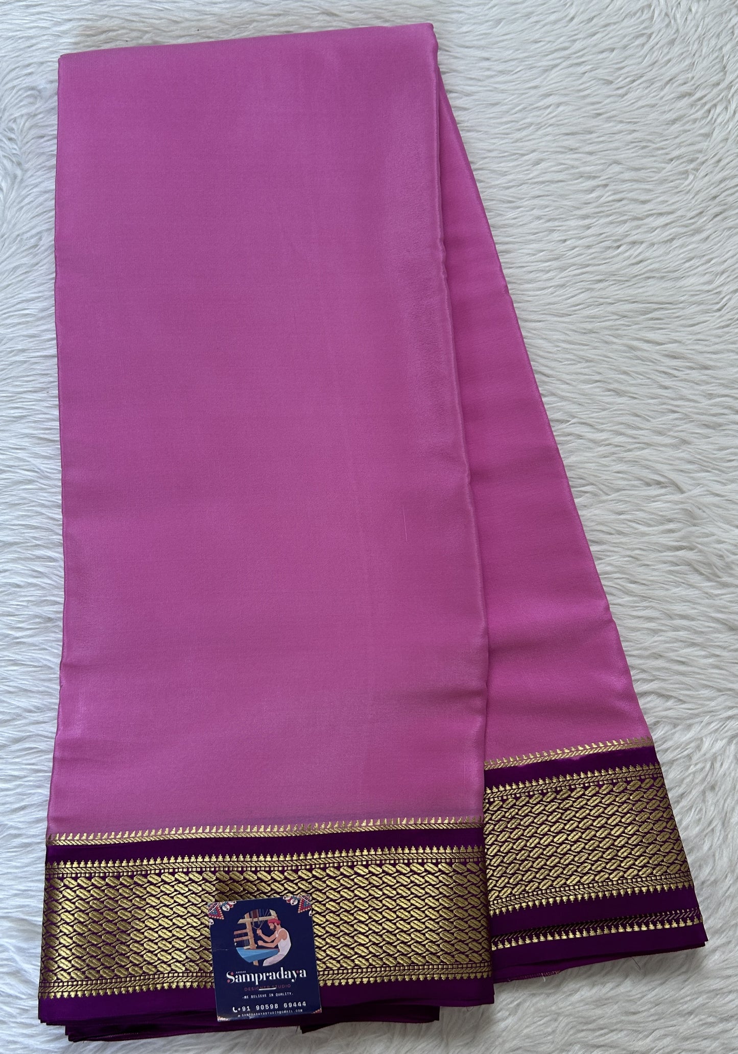 Mysore Crepe Silk Saree Light Pink Colored Complemented with a Purple Zari Border. - Sampradaya Designer Studio