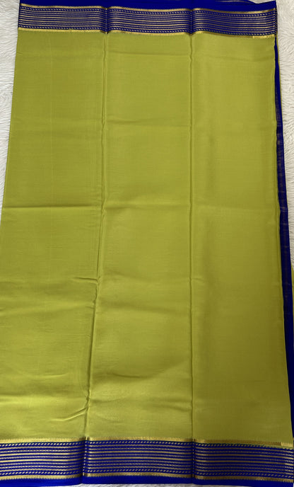 Mysore Crepe Silk Saree Light Green Colored Complemented with a Blue Zari Border. - Sampradaya Designer Studio