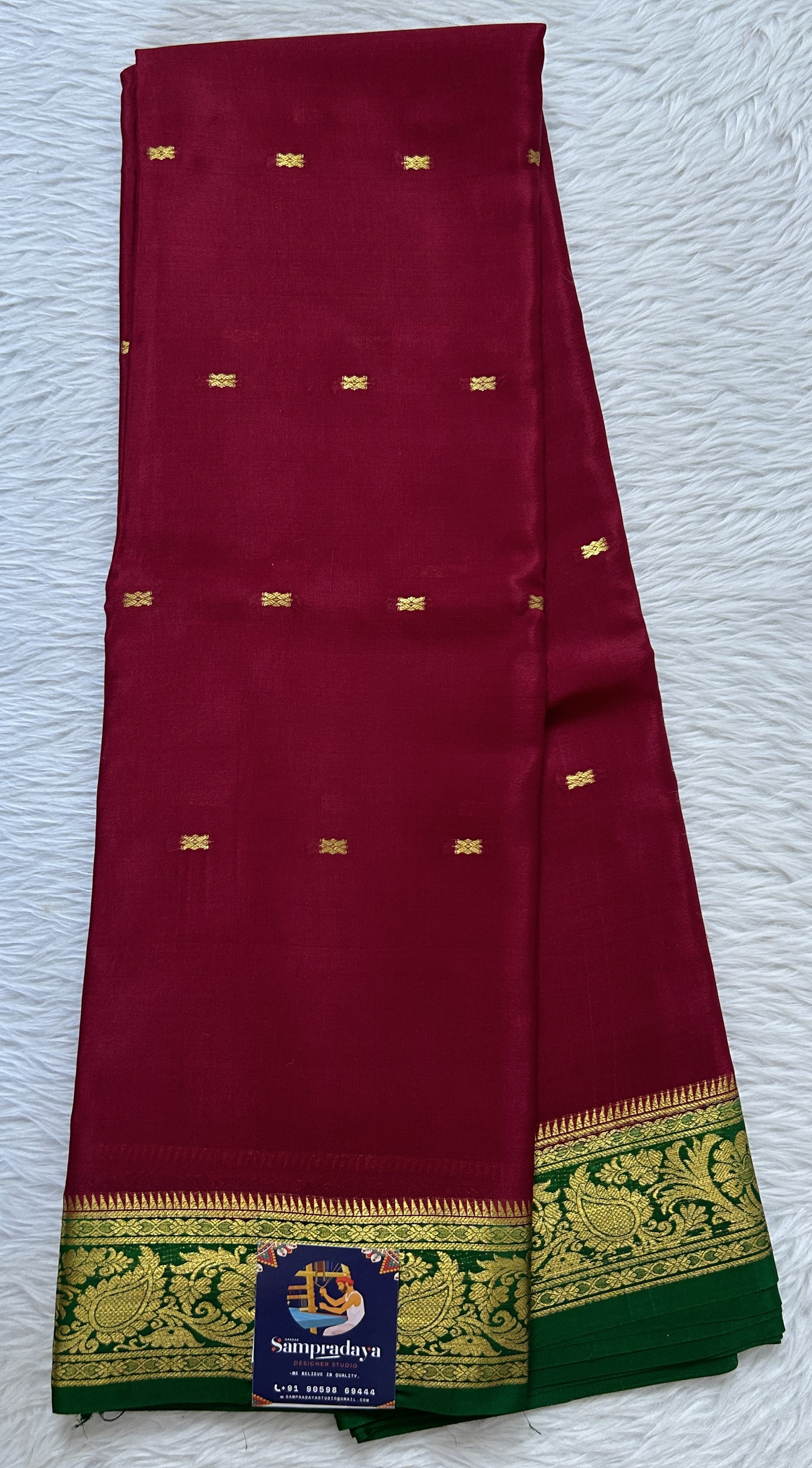 Mysore Crepe Silk Saree Maroon Colored Complemented with a Green Zari Border. - Sampradaya Designer Studio