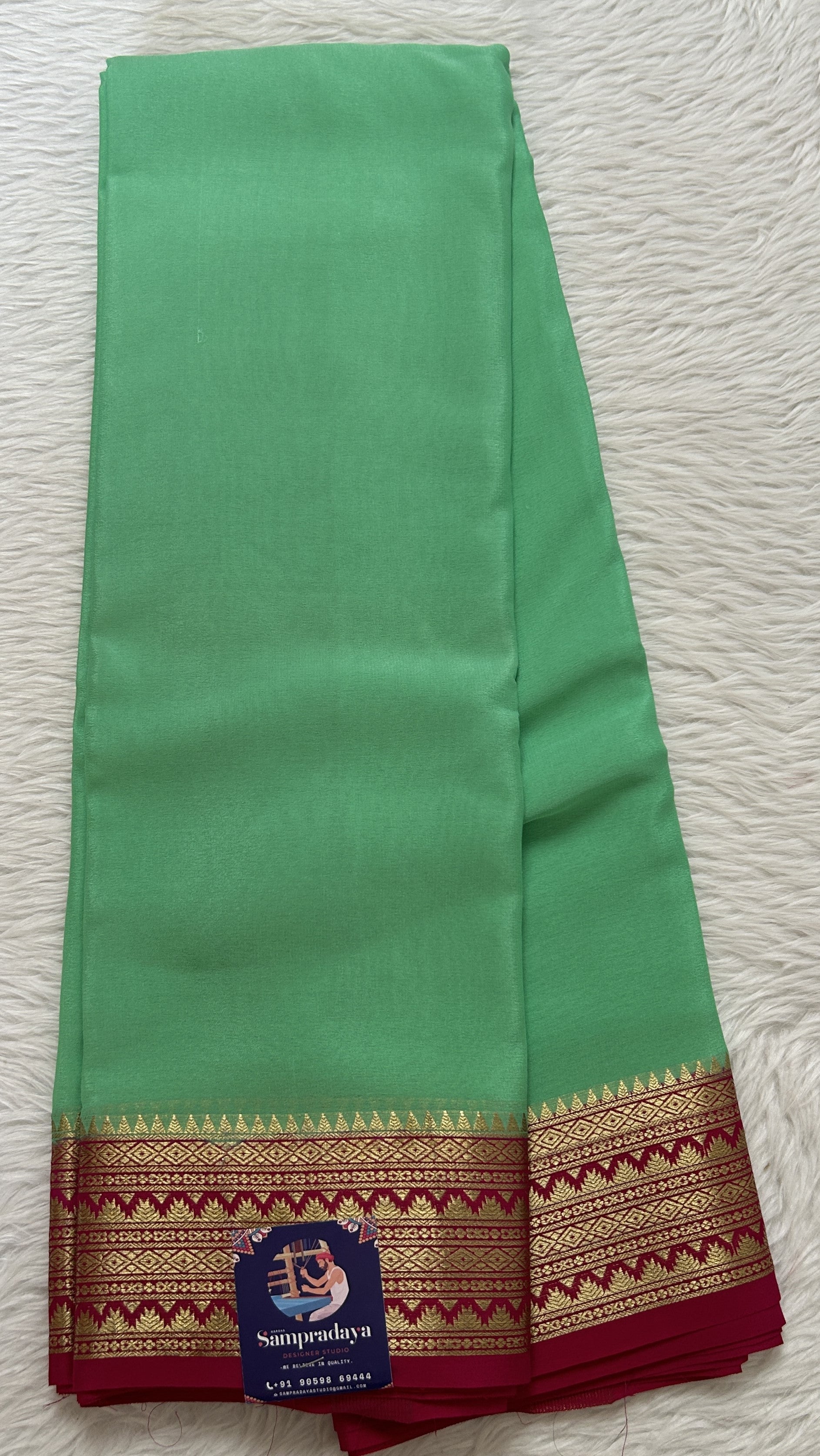 Mysore Crepe Silk Saree Light Green Colored Complemented with a Pink Zari Border. - Sampradaya Designer Studio