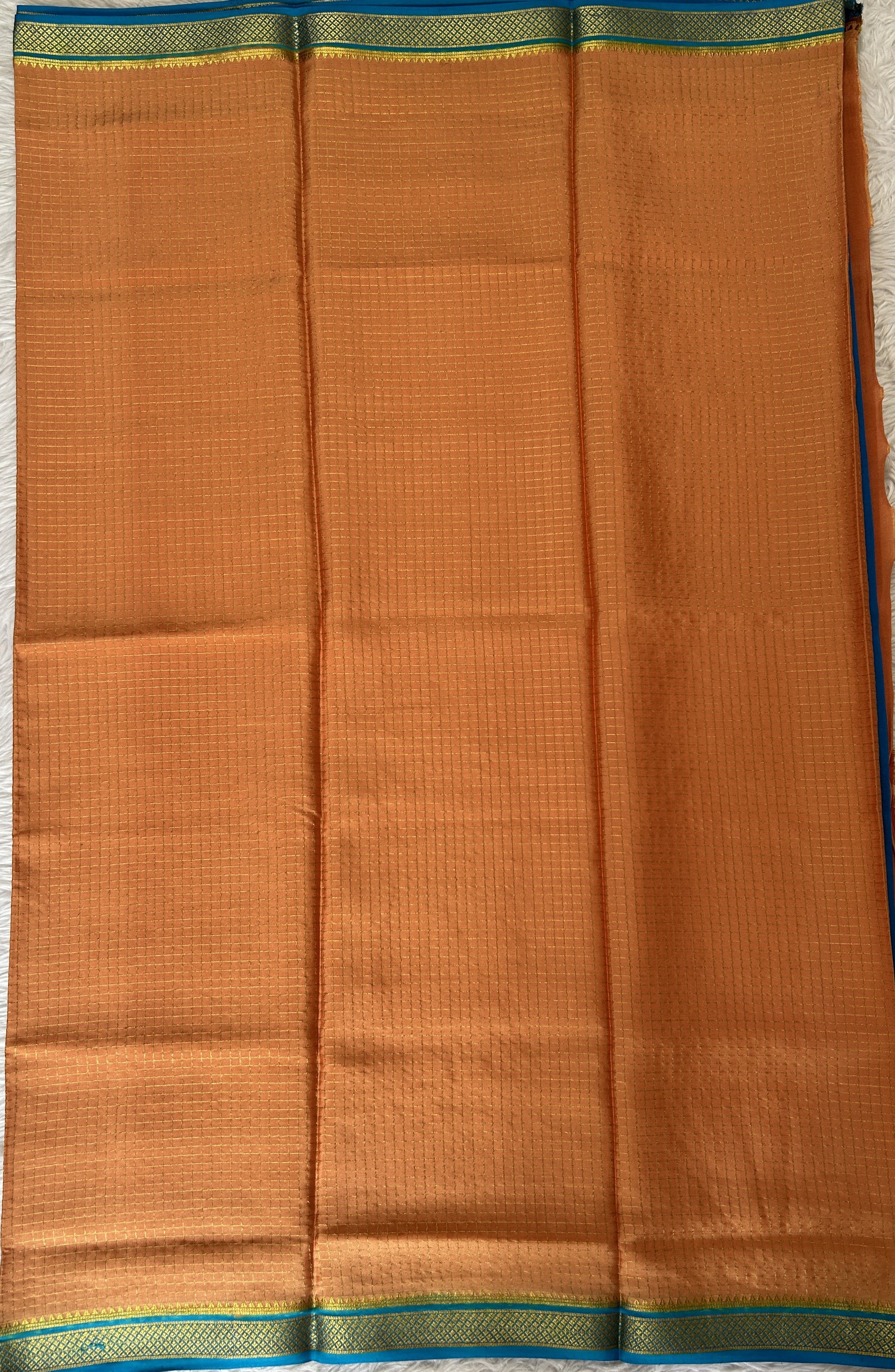 Mysore Crepe Silk Saree Light Orange Colored Complemented with a Blue Zari Border. - Sampradaya Designer Studio