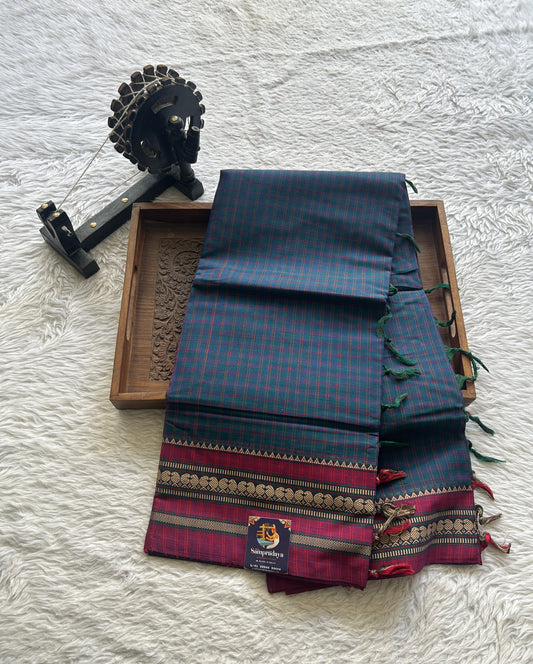 Narayanpet Cotton Checks Saree Peacock Blue Colored Complemented with a Pink Thread Border.