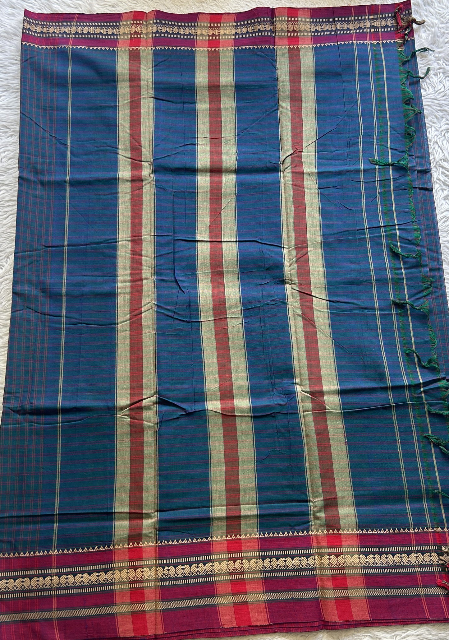 Narayanpet Cotton Checks Saree Peacock Blue Colored Complemented with a Pink Thread Border.