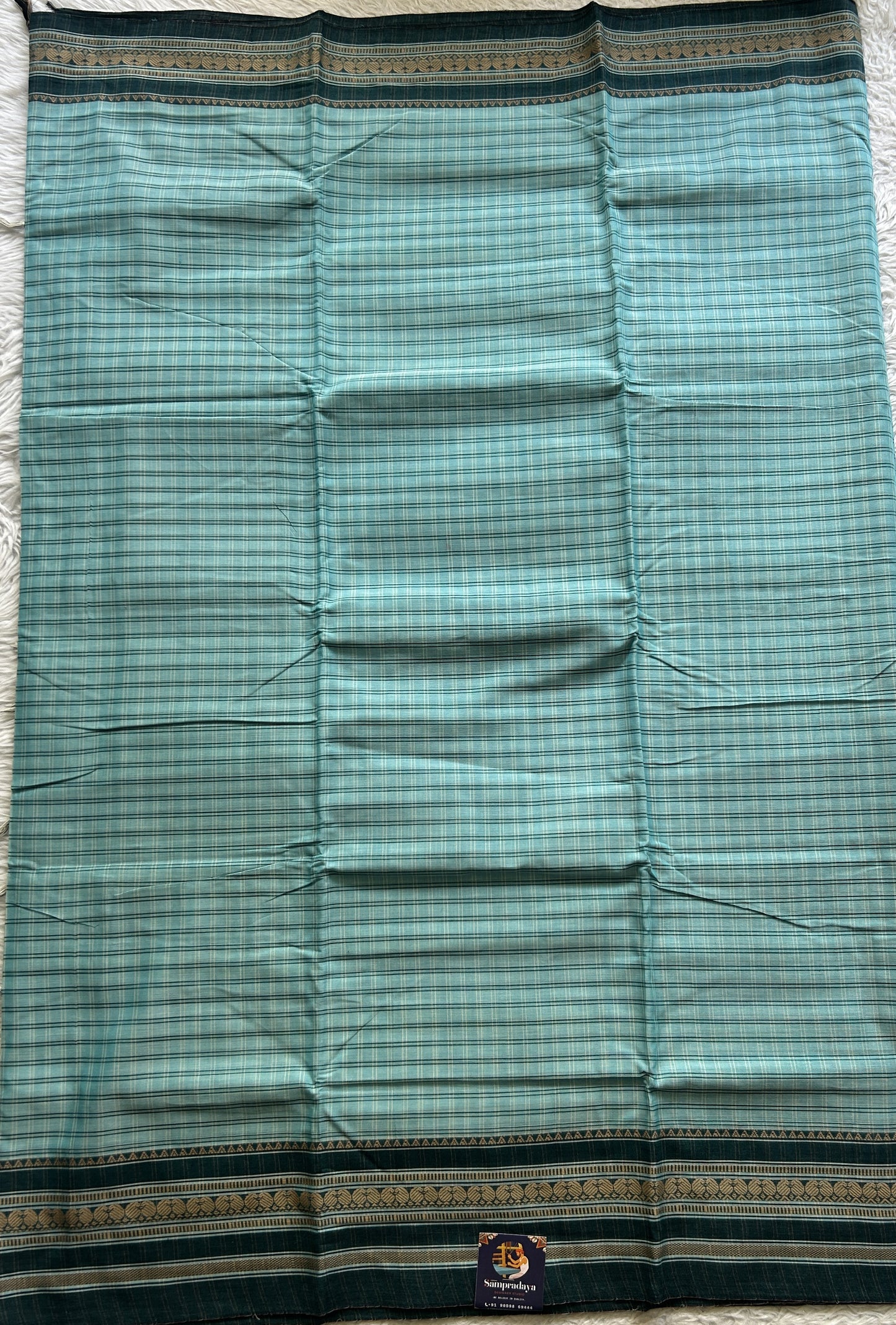 Narayanpet Cotton Checks Saree Sky Blue Colored Complemented with a Thread Gap Border.