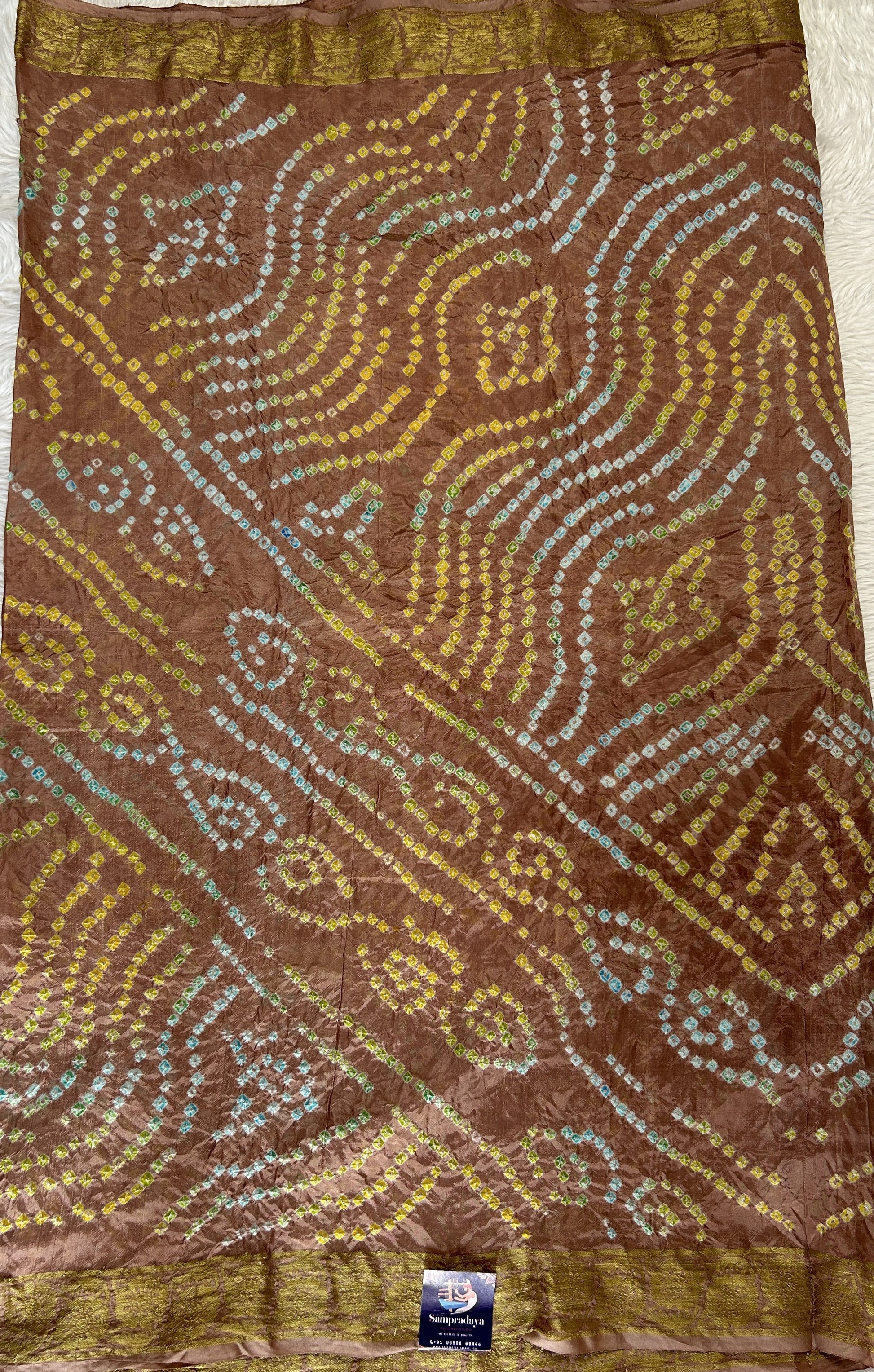 Bandhani Saree Pastel Brown Colored Complemented with a Zari Border. - Sampradaya Designer Studio