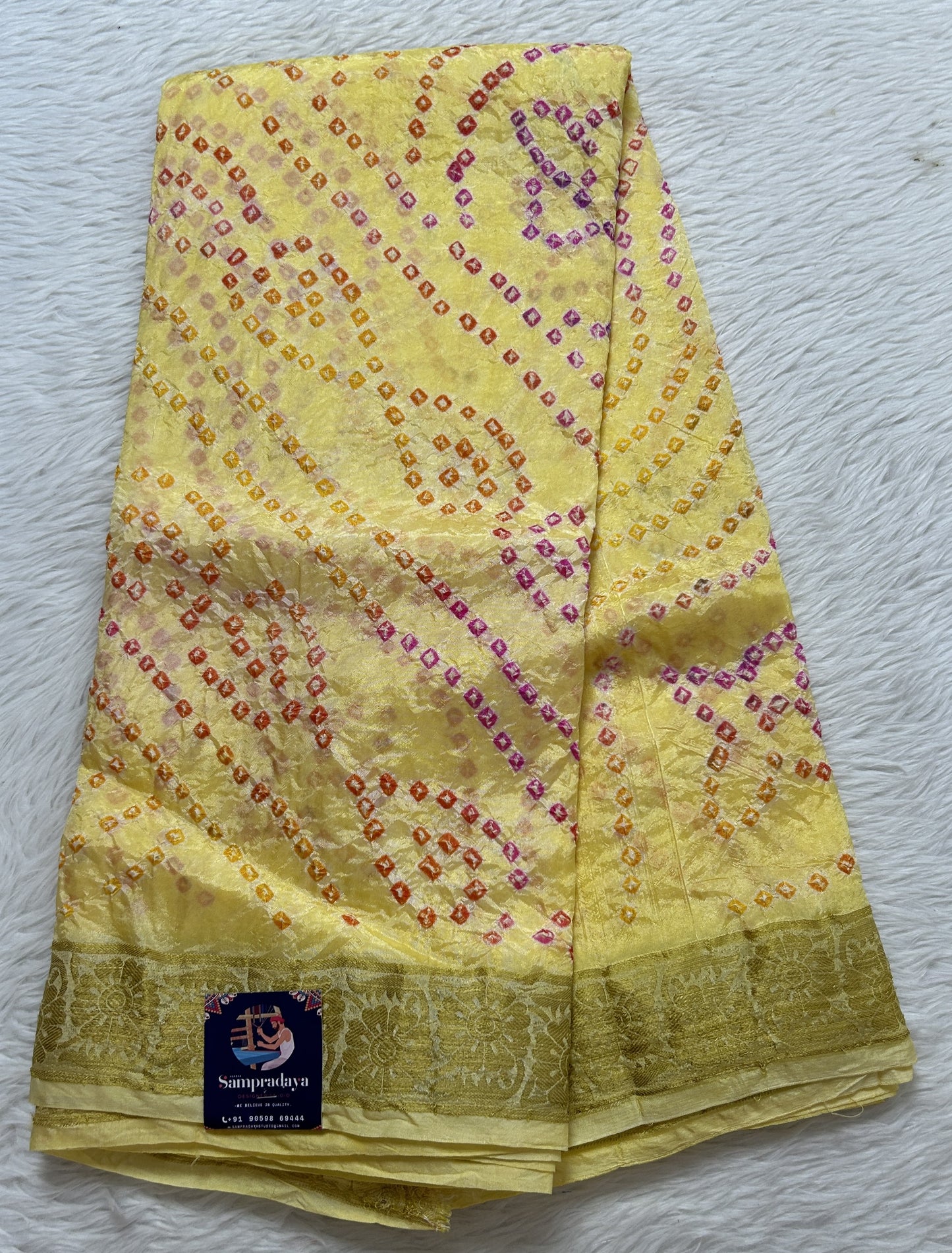 Bandhani Saree Yellow Colored Complemented with a Zari Border. - Sampradaya Designer Studio