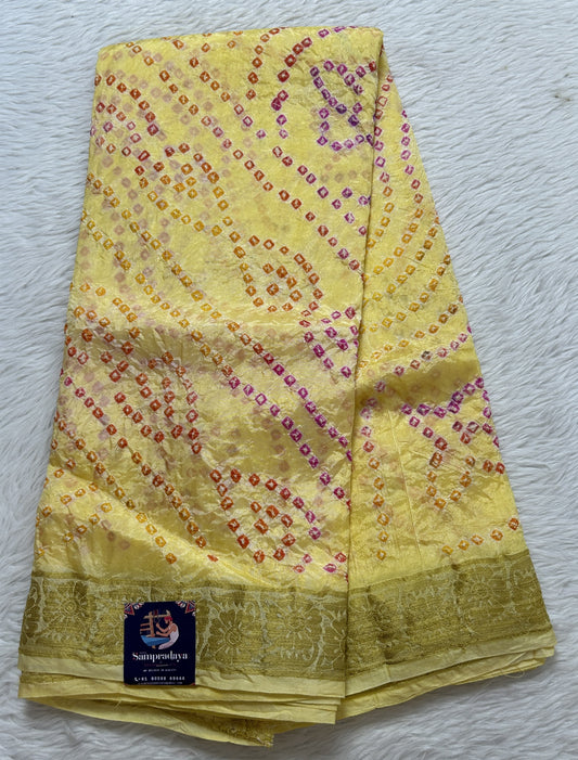 Bandhani Saree Yellow Colored Complemented with a Zari Border. - Sampradaya Designer Studio