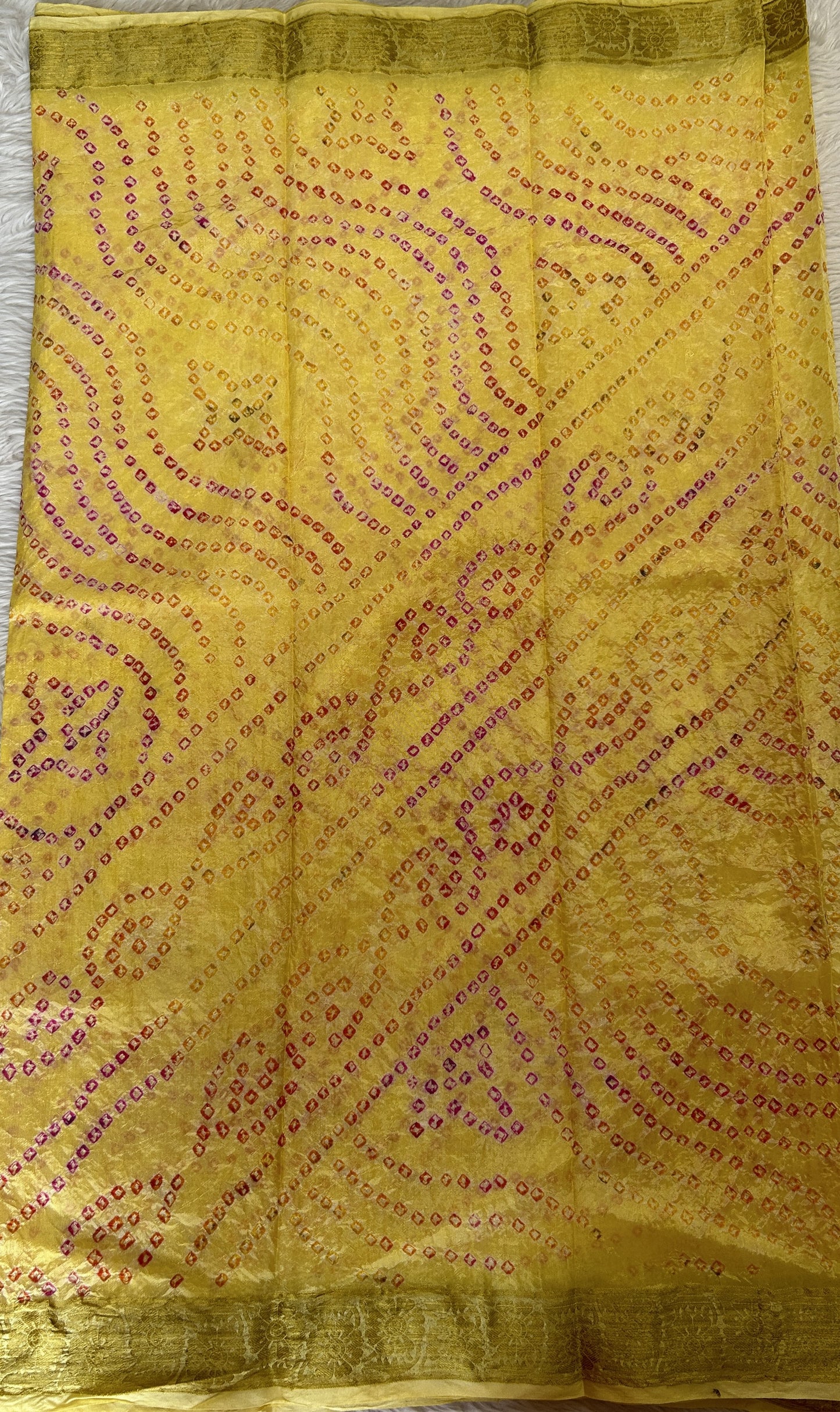 Bandhani Saree Yellow Colored Complemented with a Zari Border. - Sampradaya Designer Studio