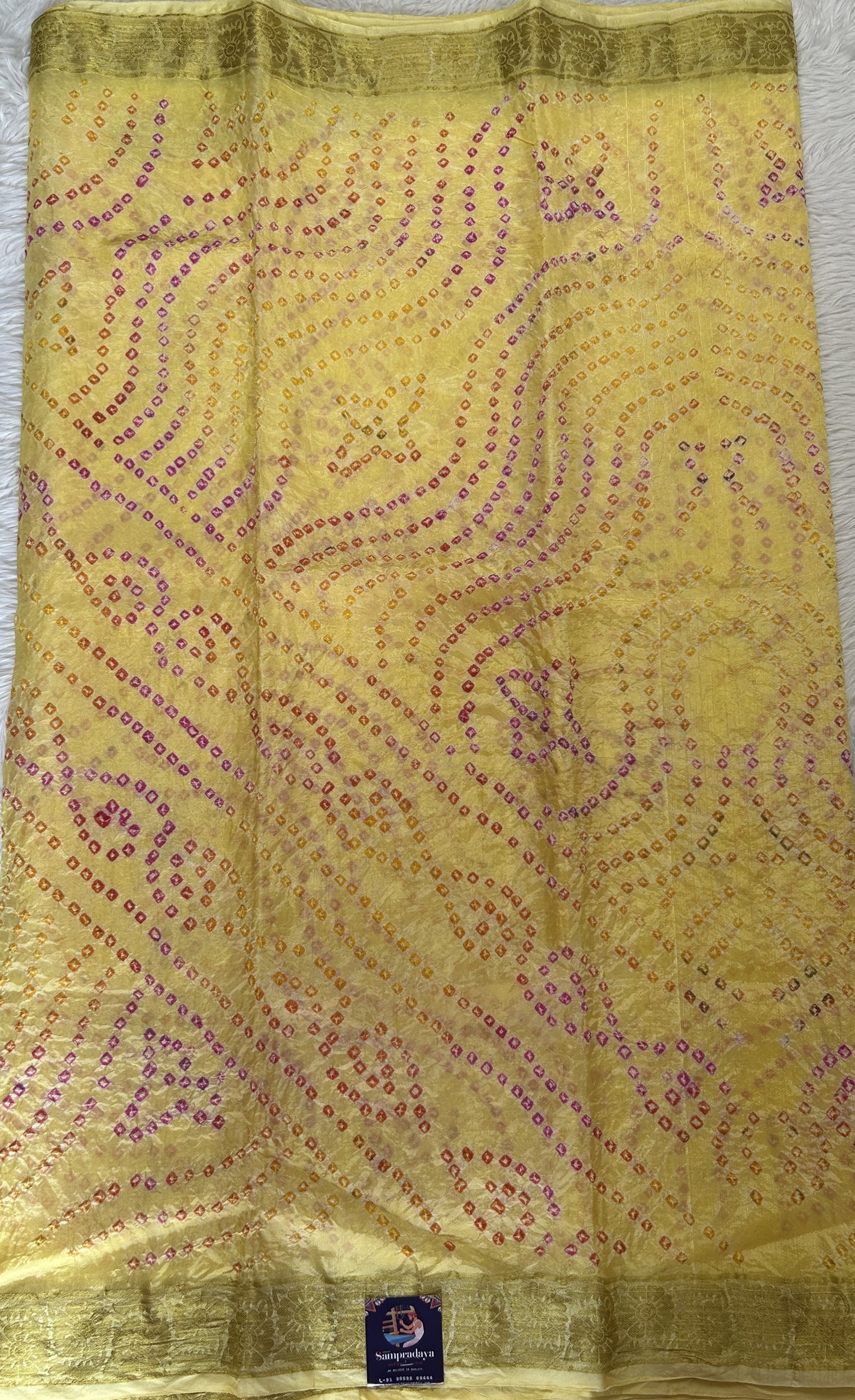 Bandhani Saree Yellow Colored Complemented with a Zari Border. - Sampradaya Designer Studio