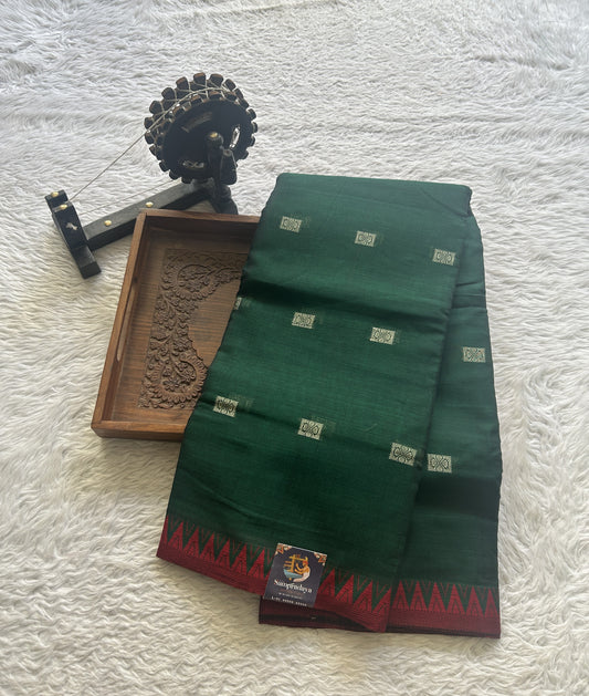 Narayanpet Cotton Buti Saree Dark Green Colored Complemented with a Thread Border.