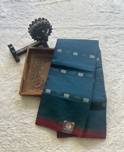 Narayanpet Cotton Buti Saree Peacock Blue Colored Complemented with a Thread Border.