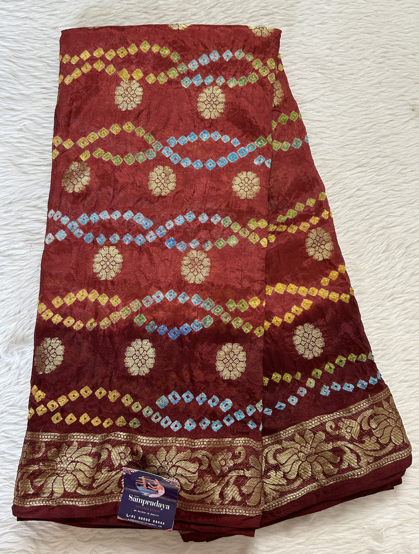 Bandhani Saree Maroon Colored Complemented with a Zari Border. - Sampradaya Designer Studio